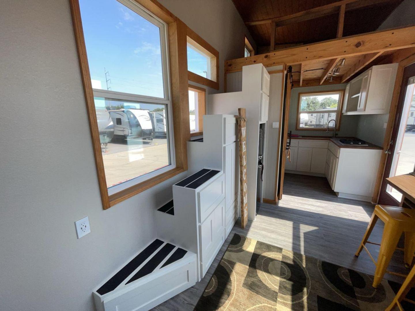 2021 TINY HOME TINY HOME (1E91U1227MM) , located at 4319 N Main St, Cleburne, TX, 76033, (817) 678-5133, 32.385960, -97.391212 - The 2021 Tiny Home 20' is a thoughtfully designed and expertly crafted tiny home that brings comfort and functionality to a whole new level. Measuring 20 feet in length, this tiny home is ingeniously designed to maximize space utilization without compromising on comfort. Its open layout creates a se - Photo#12