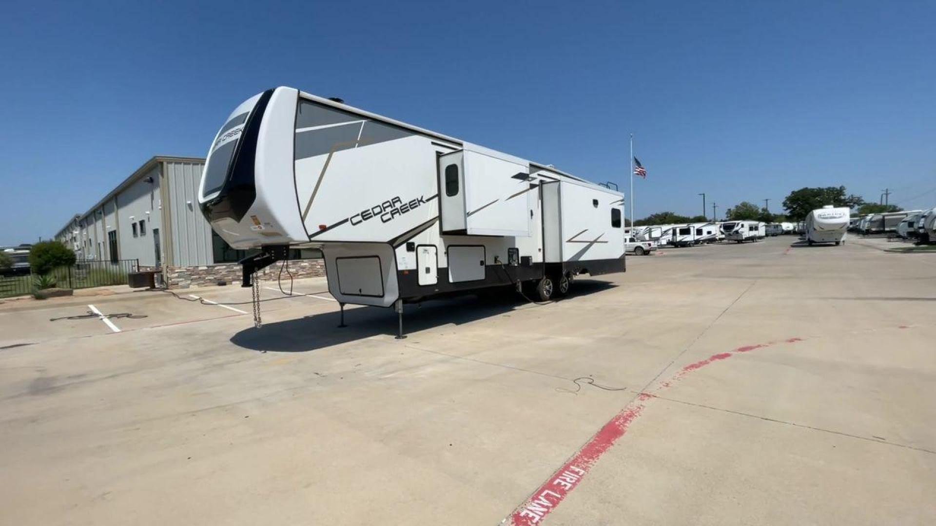 2022 FOREST RIVER CEDAR CREEK 388WDM (4X4FCRR23NS) , Length: 41.5 ft. | Dry Weight: 13,085 lbs. | Slides: 3 transmission, located at 4319 N Main St, Cleburne, TX, 76033, (817) 678-5133, 32.385960, -97.391212 - Photo#5