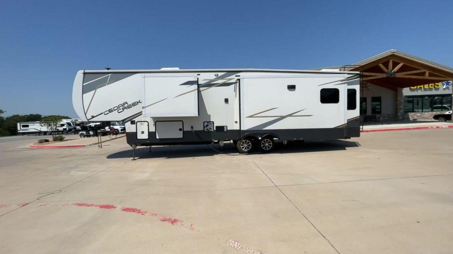 2022 FOREST RIVER CEDAR CREEK 388WDM (4X4FCRR23NS) , Length: 41.5 ft. | Dry Weight: 13,085 lbs. | Slides: 3 transmission, located at 4319 N Main St, Cleburne, TX, 76033, (817) 678-5133, 32.385960, -97.391212 - Photo#6