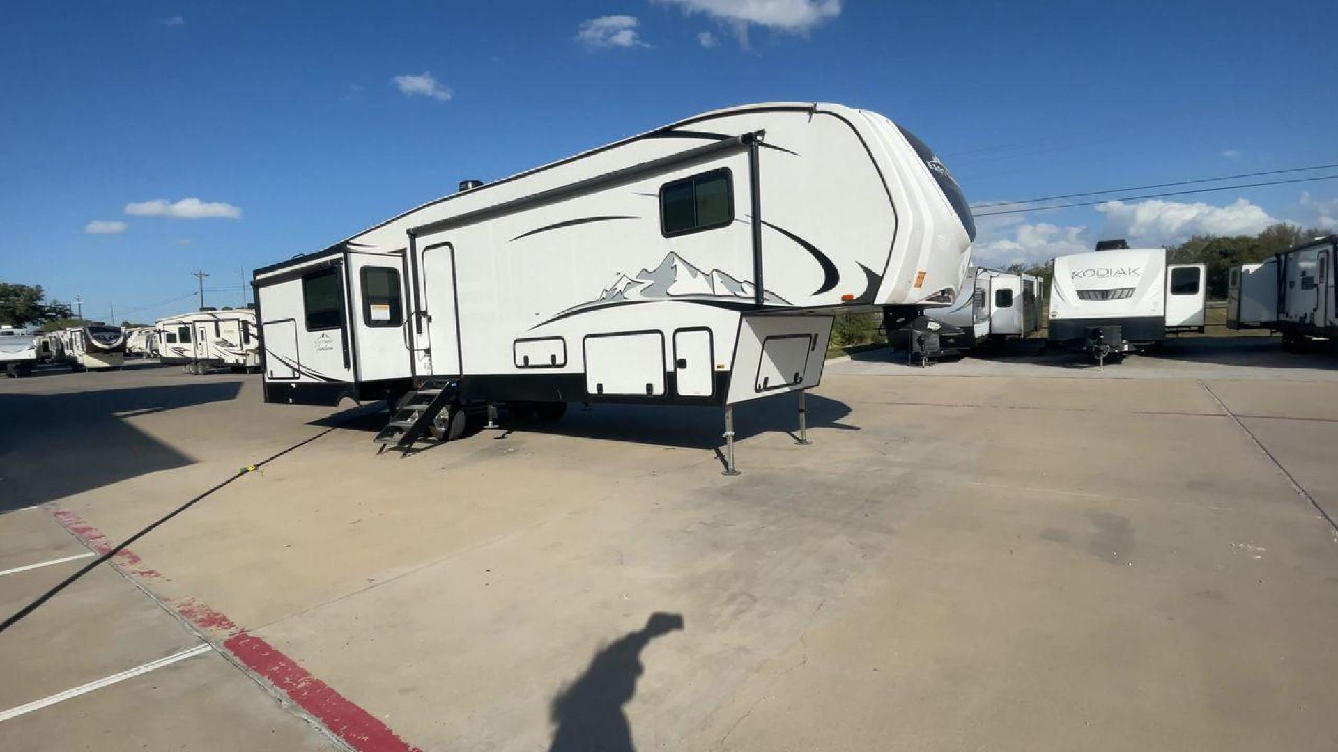 2022 FOREST RIVER EAST TO WEST TANDARA (5ZT3TD4B6N9) , Length: 41.25 ft | Dry Weight: 13,179 lbs | Slides: 4 transmission, located at 4319 N Main St, Cleburne, TX, 76033, (817) 678-5133, 32.385960, -97.391212 - At 41.25 ft. long, the front cap showcases a bold "East to West Tandara" logo, accentuated by clean, aerodynamic curves. Large, tinted windows provide natural light while maintaining privacy. Four (4) slideouts expand the living space, enhancing functionality when parked. The trailer is equipped wit - Photo#3