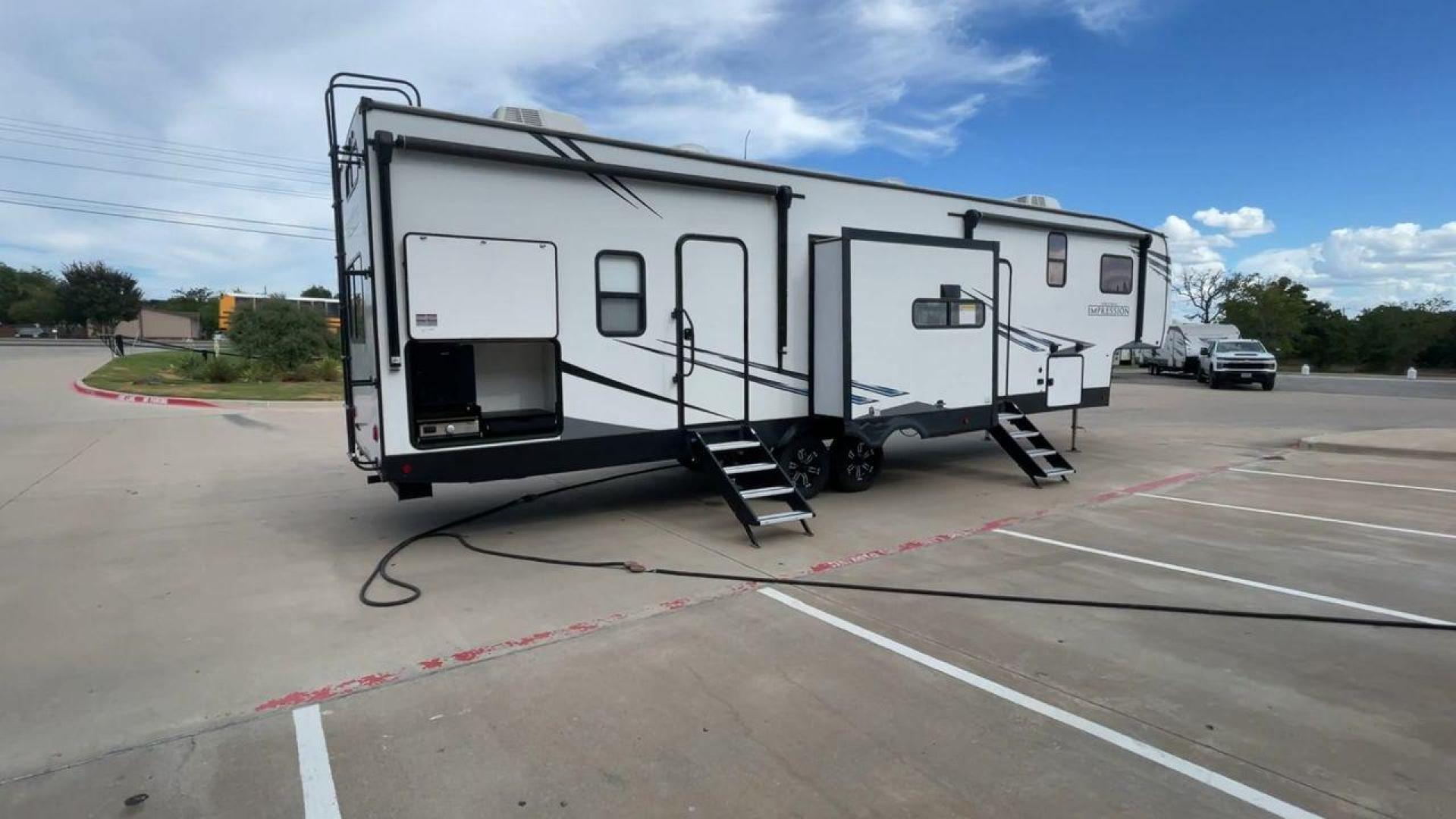 2022 FOREST RIVER IMPRESSION 330BH (5ZT3MPYB4ND) , Length: 41 ft. | Dry Weight: 10,433 lbs. | Gross Weight: 14,165 lbs. | Slides: 3 transmission, located at 4319 N Main St, Cleburne, TX, 76033, (817) 678-5133, 32.385960, -97.391212 - Photo#1