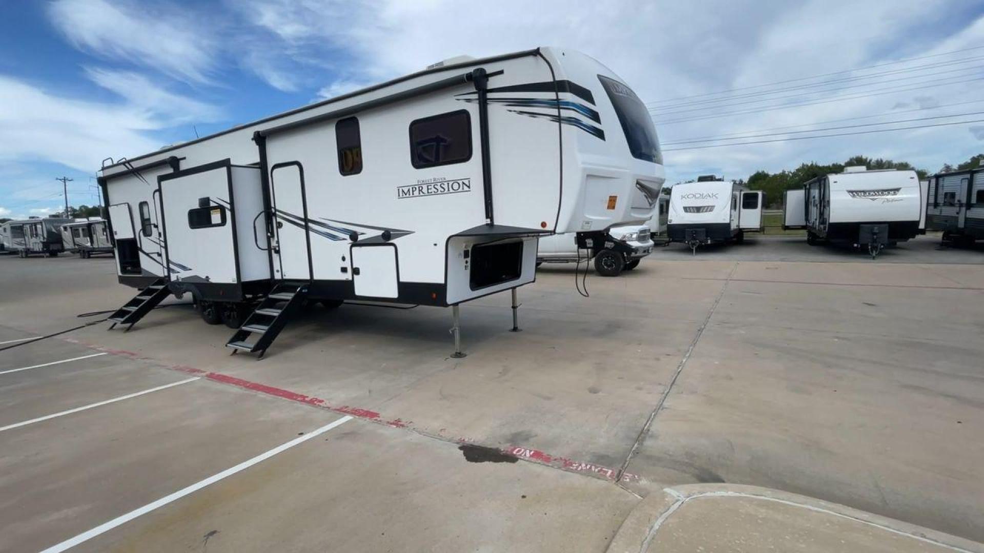 2022 FOREST RIVER IMPRESSION 330BH (5ZT3MPYB4ND) , Length: 41 ft. | Dry Weight: 10,433 lbs. | Gross Weight: 14,165 lbs. | Slides: 3 transmission, located at 4319 N Main St, Cleburne, TX, 76033, (817) 678-5133, 32.385960, -97.391212 - The 2022 Forest River Impression 330BH is a luxurious 41-foot fifth wheel. It is designed for ultimate comfort and convenience on the road. With a dry weight of 10,433 lbs and a gross weight of 14,165 lbs, it offers a spacious and functional layout perfect for long trips or family adventures. Its sl - Photo#3