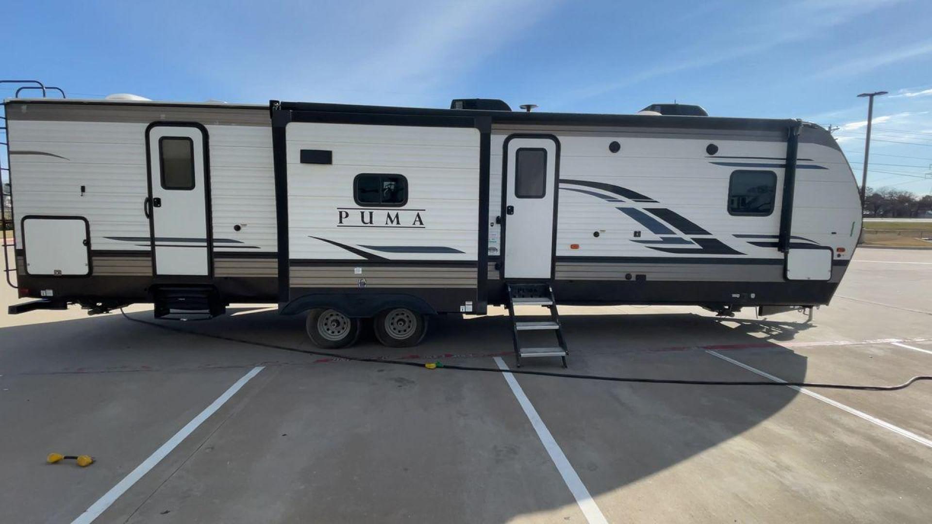 2022 FOREST RIVER PUMA 32BH2B (4X4TPUH22NP) , Length: 38.5 ft. | Dry Weight: 9,023 lbs. | Gross Weight: 11,230 lbs. | Slides: 3 transmission, located at 4319 N Main St, Cleburne, TX, 76033, (817) 678-5133, 32.385960, -97.391212 - The 2022 Forest River Puma 32BH2B is a feature-packed travel trailer designed for families and large groups who value comfort, convenience, and versatility. With its thoughtful layout, dual bathrooms, and sleeping accommodations for up to 10 people, this RV is perfect for memorable adventures. The d - Photo#2