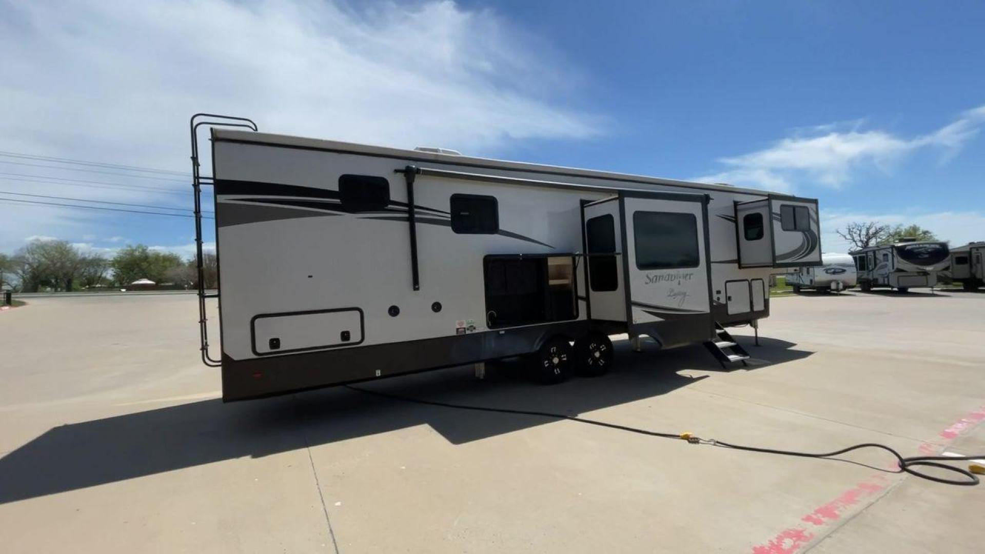 2022 FOREST RIVER SANDPIPER 391FLRB (4X4FSAR26NJ) , Length: 43.5 ft. | Dry Weight: 13,009 lbs | Gross Weight: 16,009 lbs | Slides: 5 transmission, located at 4319 N Main St, Cleburne, TX, 76033, (817) 678-5133, 32.385960, -97.391212 - The 2022 Forest River Sandpiper 391FLRB is elegance meets adventure in the great outdoors. This fifth wheel, standing at 43.5 feet tall and featuring an aluminum body and fiberglass sides, is a symbol of durability and style on the road. It weighs 13,009 lbs. dry and can carry up to 16,009 lbs gross - Photo#1