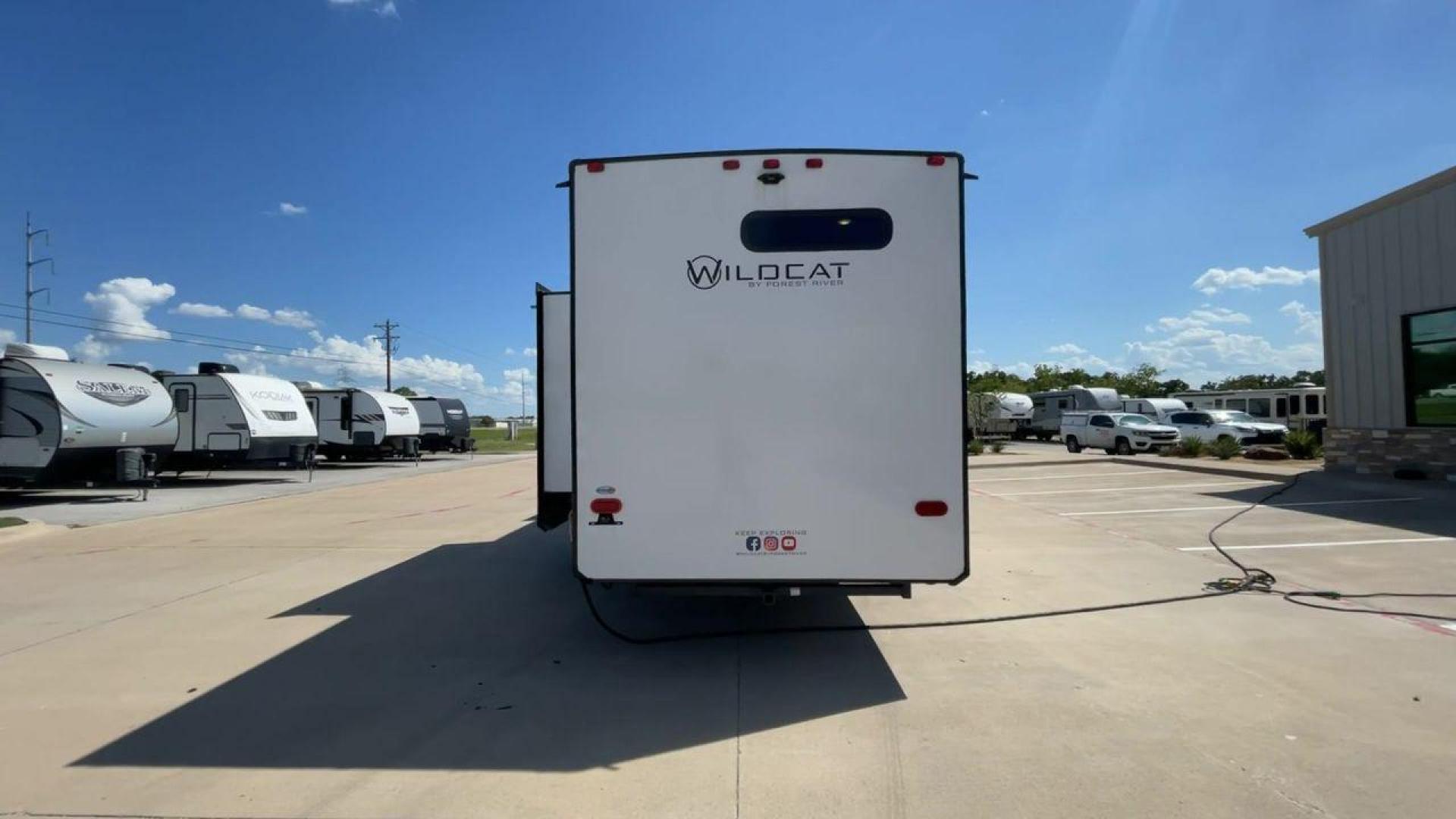 2022 FOREST RIVER WILDCAT 302BH (4X4FWCF23NG) , Length: 35.83 ft. | Dry Weight: 8,729 lbs. | Slides: 2 transmission, located at 4319 N Main St, Cleburne, TX, 76033, (817) 678-5133, 32.385960, -97.391212 - The 2022 Forest River Wildcat 302BH is a spacious and stylish RV, perfect for family adventures and extended stays. With a length of 35.83 feet and a dry weight of 8,729 lbs, this model combines space and convenience for comfortable living on the road. Featuring two large slides, it is designed to e - Photo#8