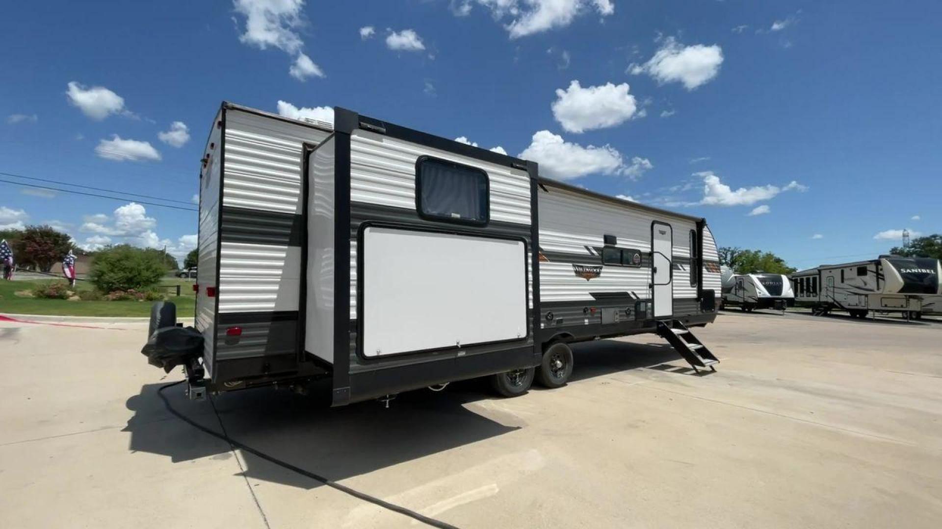 2022 FOREST RIVER WILDWOOD 31KQBTS (4X4TWDG2XN8) , Length: 36.58 ft | Dry Weight: 8,573 lbs. | Slides: 3 transmission, located at 4319 N Main St, Cleburne, TX, 76033, (817) 678-5133, 32.385960, -97.391212 - Looking for a spacious and comfortable travel trailer for your next adventure? Look no further than this 2022 Forest River Wildwood 31KQBTS, available for sale at RV Depot in Cleburne, TX. With its impressive features and unbeatable price of $42,995, this travel trailer is the perfect choice for fam - Photo#1