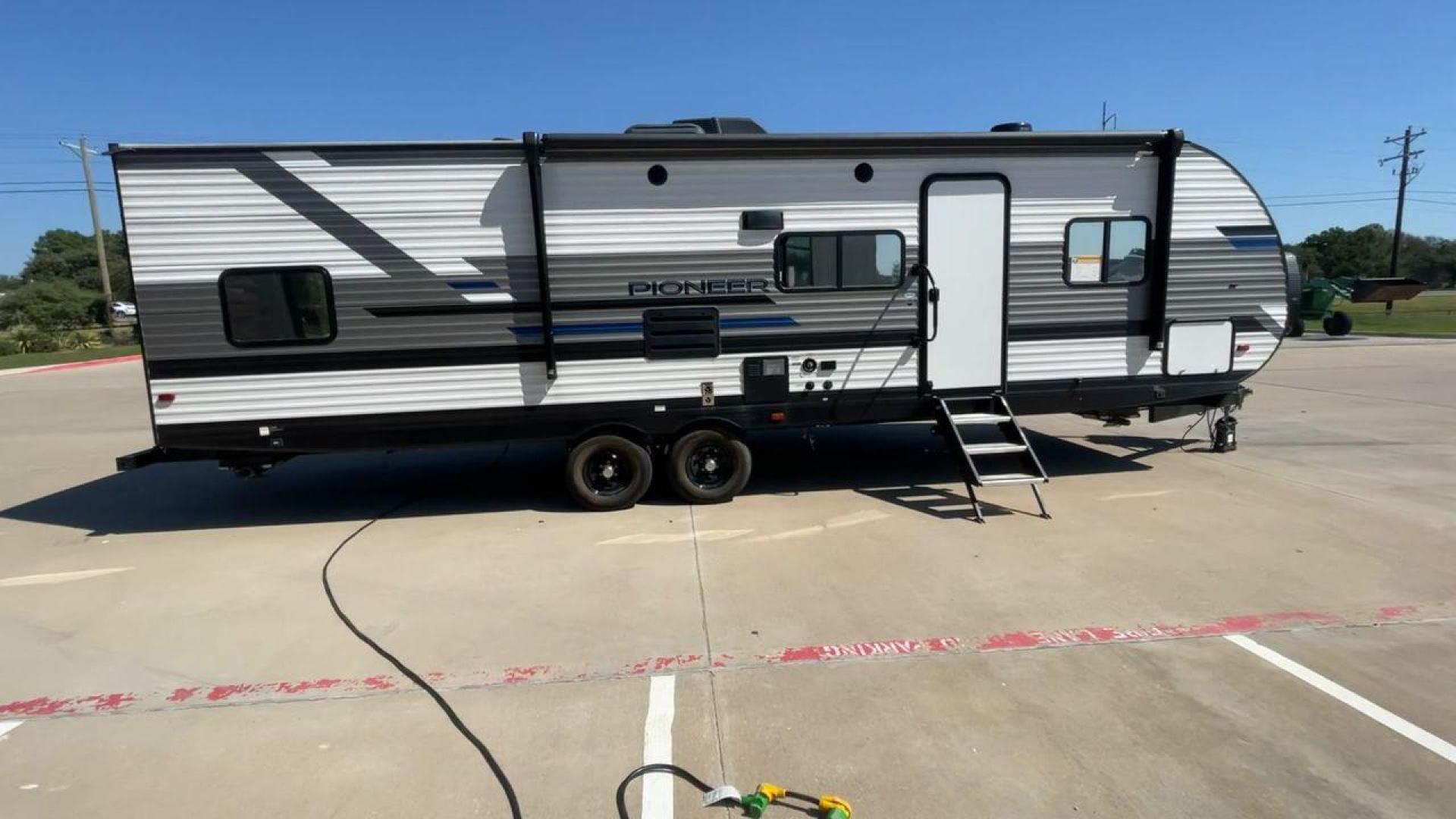 2022 HEARTLAND PIONEER QB300 (5SFPB3521NE) , Length: 35 ft. | Dry Weight: 6,896 lbs. | Gross Weight: 9,000 lbs. | Slides: 1 transmission, located at 4319 N Main St, Cleburne, TX, 76033, (817) 678-5133, 32.385960, -97.391212 - The 2022 Heartland Pioneer QB300 is a spacious and well-equipped travel trailer, perfect for family adventures. With a length of 35 feet, this model provides ample living space while maintaining a dry weight of 6,896 lbs. and a gross weight of 9,000 lbs. It includes 1 slide-out, optimizing interior - Photo#2