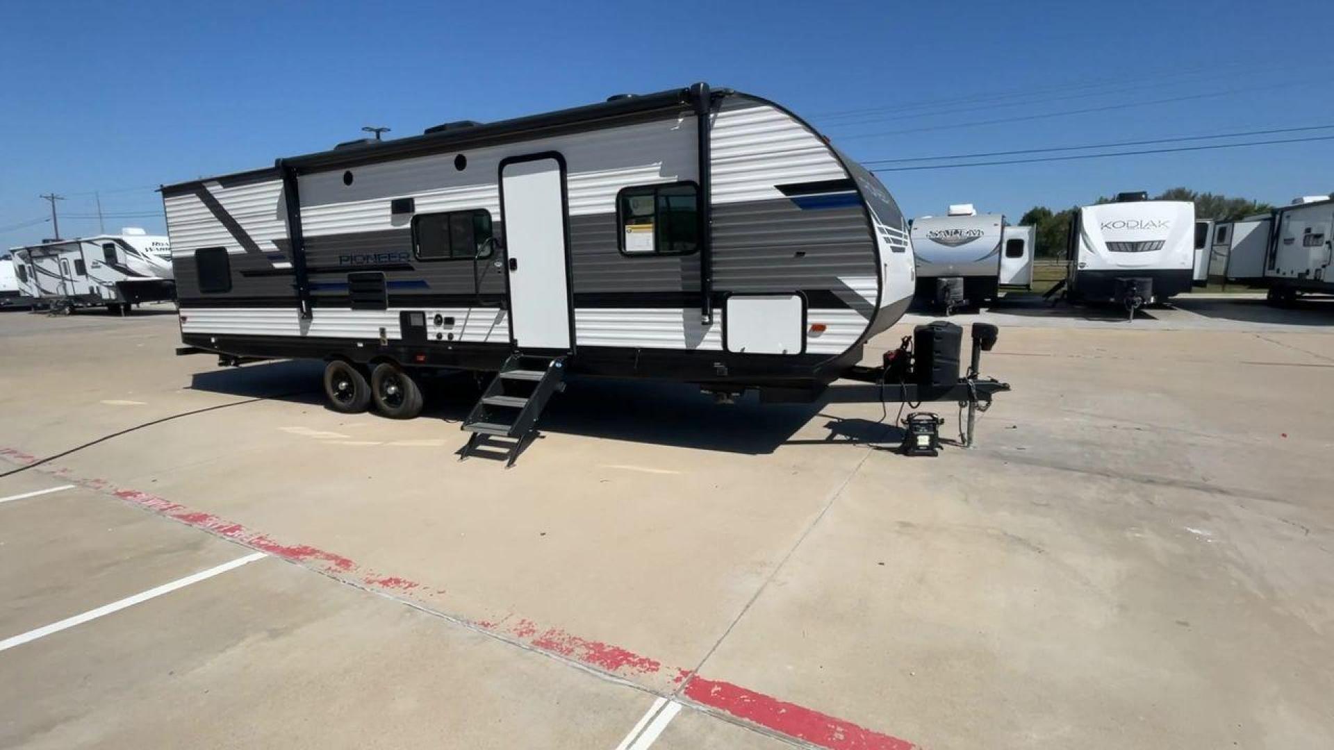 2022 HEARTLAND PIONEER QB300 (5SFPB3521NE) , Length: 35 ft. | Dry Weight: 6,896 lbs. | Gross Weight: 9,000 lbs. | Slides: 1 transmission, located at 4319 N Main St, Cleburne, TX, 76033, (817) 678-5133, 32.385960, -97.391212 - The 2022 Heartland Pioneer QB300 is a spacious and well-equipped travel trailer, perfect for family adventures. With a length of 35 feet, this model provides ample living space while maintaining a dry weight of 6,896 lbs. and a gross weight of 9,000 lbs. It includes 1 slide-out, optimizing interior - Photo#3