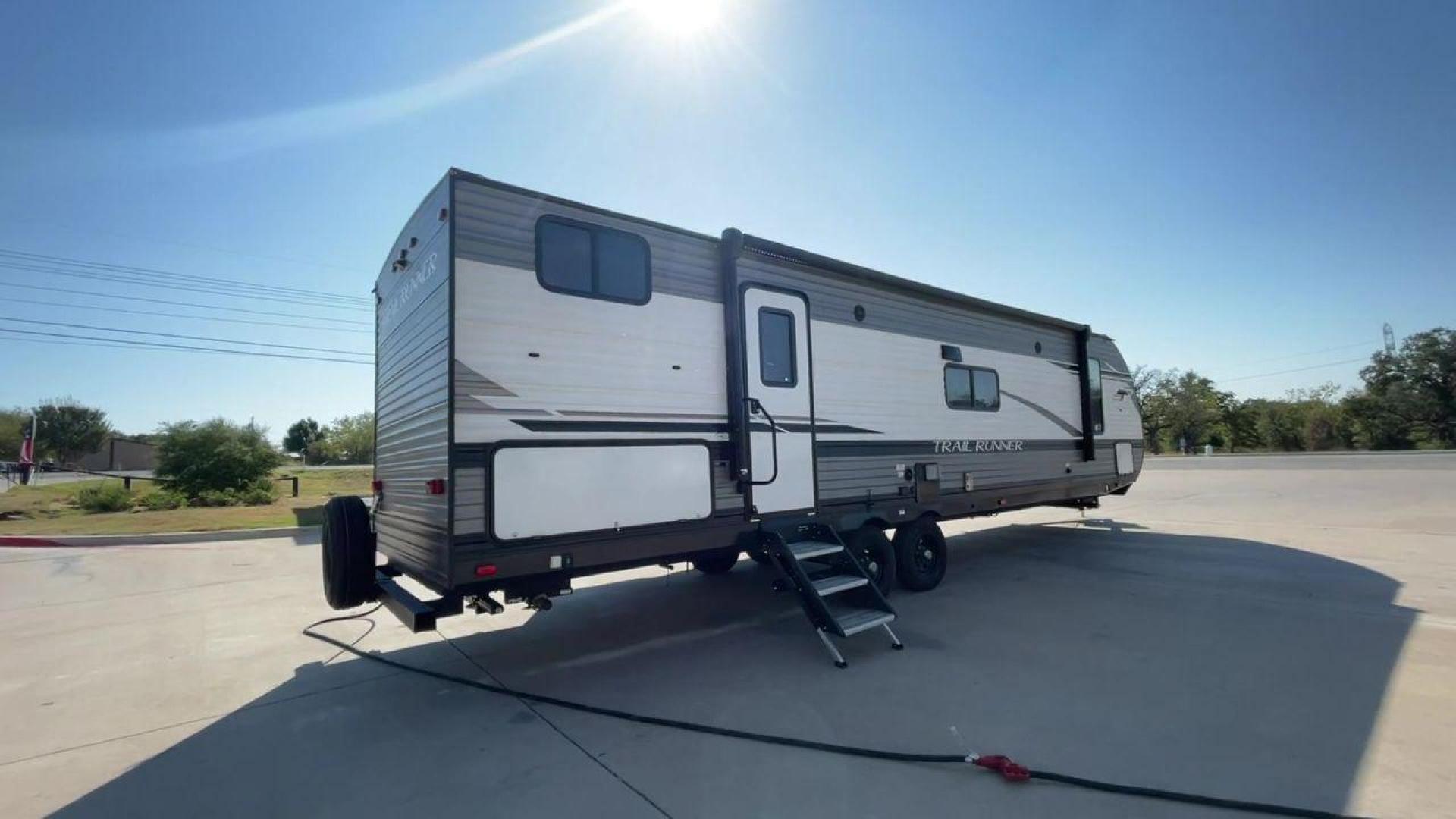 2022 HEARTLAND TRAIL RUNNER 31DB (5SFEB3728NE) , Length: 36.92 ft. | Dry Weight: 7,040 lbs. | Gross Weight: 9,642 lbs. | Slides: 1 transmission, located at 4319 N Main St, Cleburne, TX, 76033, (817) 678-5133, 32.385960, -97.391212 - The 2022 Heartland Trail Runner 31DB is a flexible, family-friendly travel trailer that will make your camping trip more enjoyable. With a length of 36.92 feet and a dry weight of 7,040 pounds, this trailer gives you plenty of room and comfort for your trips. The gross weight of 9,642 pounds means t - Photo#1