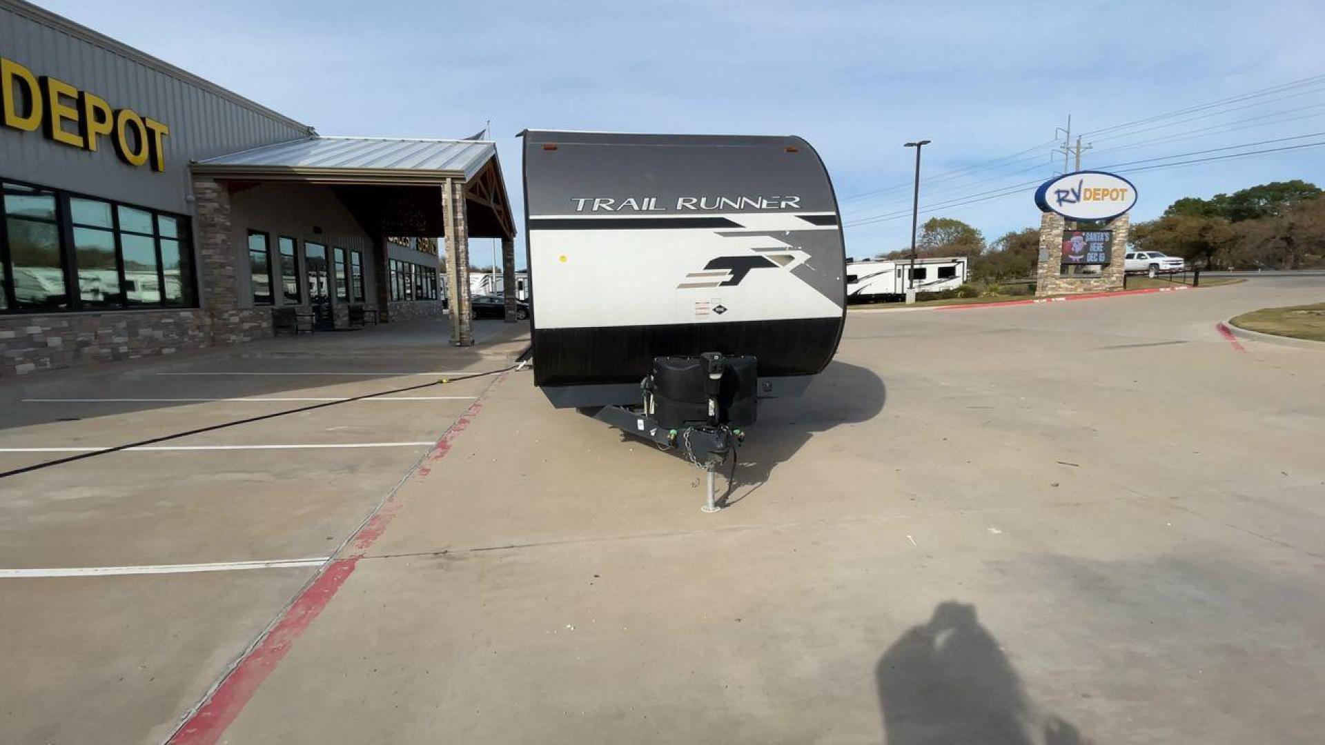 2022 HEARTLAND TRAIL RUNNER 31DB (5SFEB372XNE) , Length: 36.92 ft. | Dry Weight: 7,040 lbs. | Gross Weight: 9,642 lbs. | Slides: 1 transmission, located at 4319 N Main St, Cleburne, TX, 76033, (817) 678-5133, 32.385960, -97.391212 - The 2022 Heartland Trail Runner 31DB has a robust and functional exterior design with modern accents. The front cap of the RV is curved for better aerodynamics, with the bold Trail Runner logo prominently displayed. The front also features a black diamond-plate guard, which offers protection from de - Photo#4