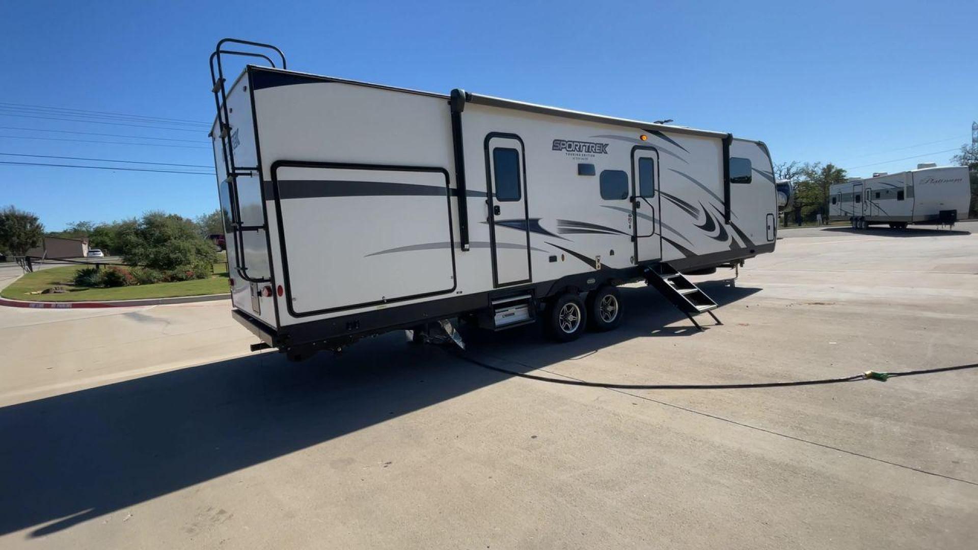 2022 KZ SPORT TREK 343VBH (4EZT13423N8) , Length: 37.67 ft. | Dry Weight: 8,820 lbs. | Slides: 3 transmission, located at 4319 N Main St, Cleburne, TX, 76033, (817) 678-5133, 32.385960, -97.391212 - The 2022 Venture RV Sport Trek 343VBH showcases a sleek and modern exterior with a bright white finish and stylish graphics. It stretches an impressive 37.67 feet. This unit is equipped with a power tongue jack and propane tanks at the front for easy hitching and extended camping capabilities. The s - Photo#1