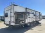 2022 KZ SPORT TREK 343VBH (4EZT13423N8) , Length: 37.67 ft. | Dry Weight: 8,820 lbs. | Slides: 3 transmission, located at 4319 N Main St, Cleburne, TX, 76033, (817) 678-5133, 32.385960, -97.391212 - The 2022 Venture RV Sport Trek 343VBH showcases a sleek and modern exterior with a bright white finish and stylish graphics. It stretches an impressive 37.67 feet. This unit is equipped with a power tongue jack and propane tanks at the front for easy hitching and extended camping capabilities. The s - Photo#24