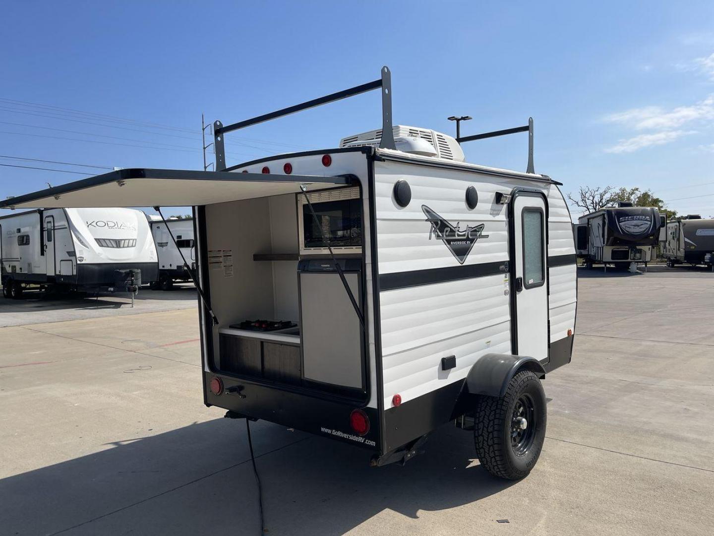 2022 RIVERSIDE RETRO 511 (59CCC1213NL) , Length: 12.67 ft. | Dry Weight: 1,540 lbs. transmission, located at 4319 N Main St, Cleburne, TX, 76033, (817) 678-5133, 32.385960, -97.391212 - The 2022 Riverside Retro 511 is a charming, compact travel trailer that captures the essence of vintage camping with modern amenities. Measuring just 12.67 feet in length and weighing a lightweight 1,540 pounds, this teardrop-shaped trailer is easily towable by a wide range of vehicles. This makes i - Photo#24