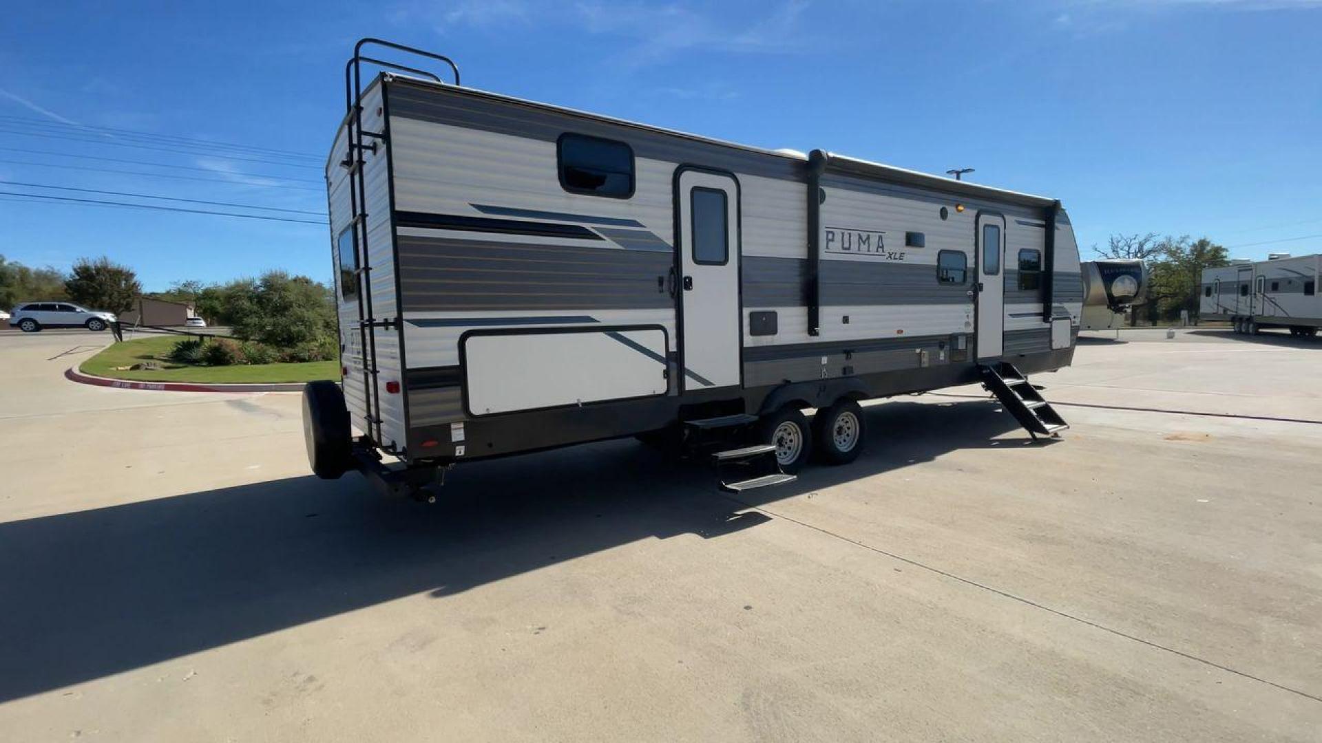 2023 FOREST RIVER PUMA 31BHSC (5ZT2PUWB4P4) , Length: 35.5 ft. | Dry Weight: 7,946 lbs. | Gross Weight: 9,600 lbs. | Slides: 2 transmission, located at 4319 N Main St, Cleburne, TX, 76033, (817) 678-5133, 32.385960, -97.391212 - The 2023 Palomino Puma 31BHSC stands out with its sleek and modern exterior design. Measuring 35.5 feet in length, this unit is built for comfort and style. Its aluminum siding features a striking two-tone finish. With two large slide-outs, this RV offers expanded living space when parked. The front - Photo#1