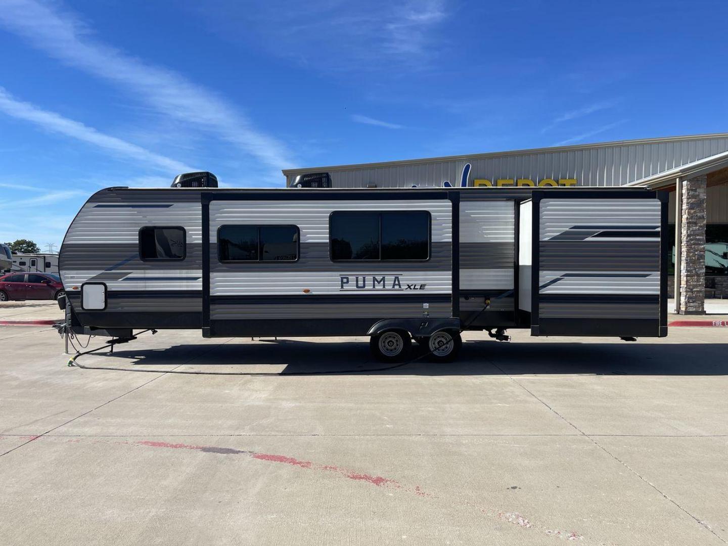 2023 FOREST RIVER PUMA 31BHSC (5ZT2PUWB4P4) , Length: 35.5 ft. | Dry Weight: 7,946 lbs. | Gross Weight: 9,600 lbs. | Slides: 2 transmission, located at 4319 N Main St, Cleburne, TX, 76033, (817) 678-5133, 32.385960, -97.391212 - The 2023 Palomino Puma 31BHSC stands out with its sleek and modern exterior design. Measuring 35.5 feet in length, this unit is built for comfort and style. Its aluminum siding features a striking two-tone finish. With two large slide-outs, this RV offers expanded living space when parked. The front - Photo#22