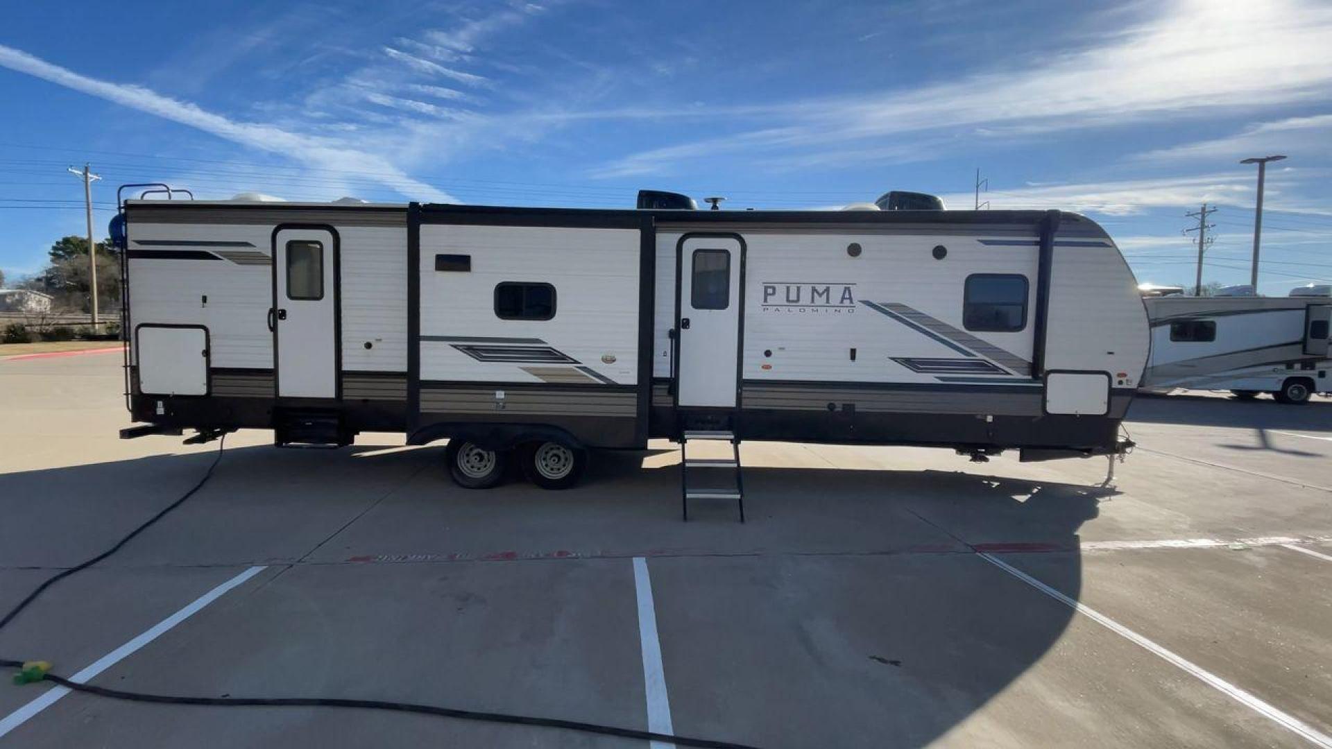 2023 FOREST RIVER PUMA 32BH2B (4X4TPUH21PP) , Length: 38.5 ft. | Dry Weight: 9,023 lbs. | Gross Weight: 11,230 lbs | Slides: 3 transmission, located at 4319 N Main St, Cleburne, TX, 76033, (817) 678-5133, 32.385960, -97.391212 - With its ample space and adaptability, the 2023 Palomino Puma 32BH2B travel trailer is perfect for hosting extended families and gatherings. This model provides generous living space while maintaining excellent maneuverability on the road. It measures 38.5 feet in length and has a dry weight of 9,02 - Photo#2