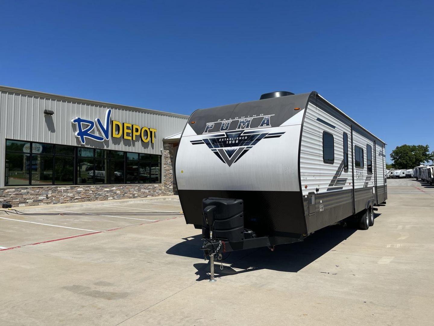 2023 FOREST RIVER PUMA 32BH2B (4X4TPUH21PP) , Length: 38.5 ft. | Dry Weight: 9,023 lbs. | Gross Weight: 11,230 lbs | Slides: 3 transmission, located at 4319 N Main St, Cleburne, TX, 76033, (817) 678-5133, 32.385960, -97.391212 - With its ample space and adaptability, the 2023 Palomino Puma 32BH2B travel trailer is perfect for hosting extended families and gatherings. This model provides generous living space while maintaining excellent maneuverability on the road. It measures 38.5 feet in length and has a dry weight of 9,02 - Photo#0