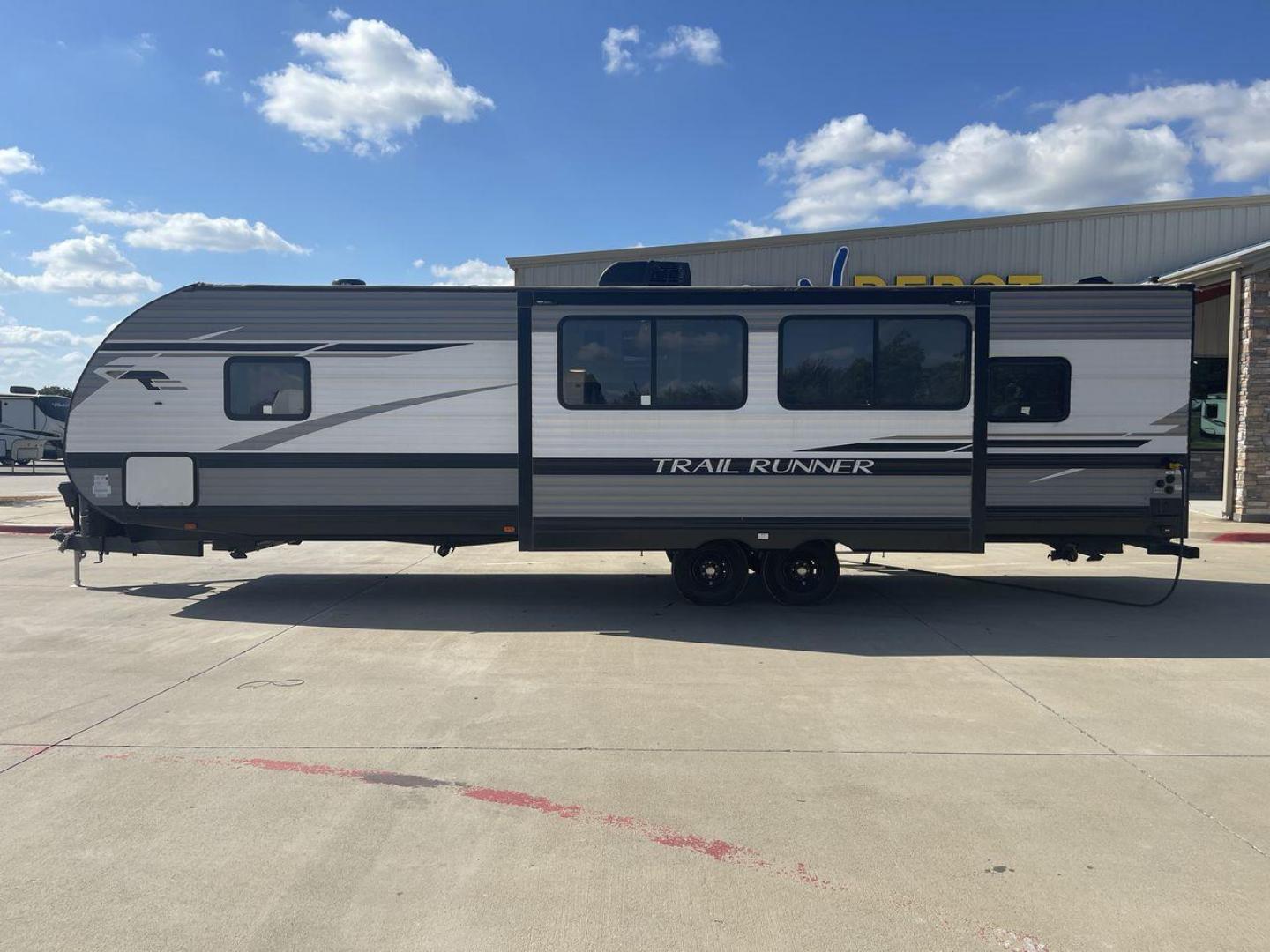 2023 HEARTLAND TRAIL RUNNER 31DB (5SFEB3723PE) , Length: 36.92 ft | Dry Weight: 7,040 lbs | GVWR: 9,642 lbs | Slides: 1 transmission, located at 4319 N Main St, Cleburne, TX, 76033, (817) 678-5133, 32.385960, -97.391212 - The 2023 Heartland Trail Runner 31DB is a versatile and spacious travel trailer designed for families and adventure enthusiasts. This vehicle is the perfect option for families or groups looking to embark on memorable road trips. The travel trailer is a bunkhouse, and features a family-centric layou - Photo#24