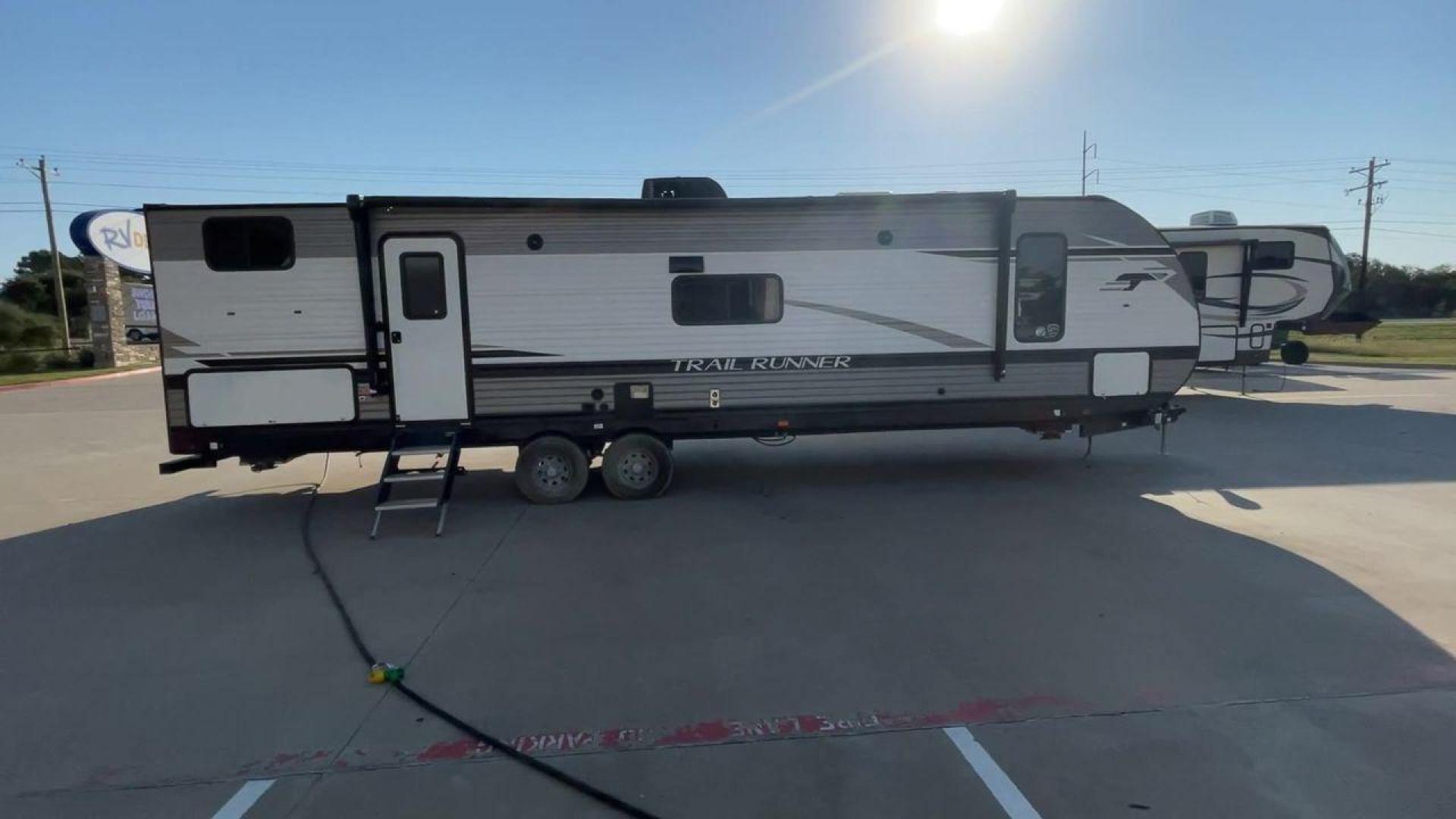 2023 HEARTLAND TRAIL RUNNER 31DB (5SFEB3722PE) , Length: 36.92 ft | Dry Weight: 7,040 lbs | GVWR: 9,642 lbs | Slides: 1 transmission, located at 4319 N Main St, Cleburne, TX, 76033, (817) 678-5133, 32.385960, -97.391212 - The 2023 Heartland Trail Runner 31DB is a versatile and spacious travel trailer designed for families and adventure enthusiasts. This vehicle is the perfect option for families or groups looking to embark on memorable road trips. The travel trailer is a bunkhouse, and features a family-centric layou - Photo#2