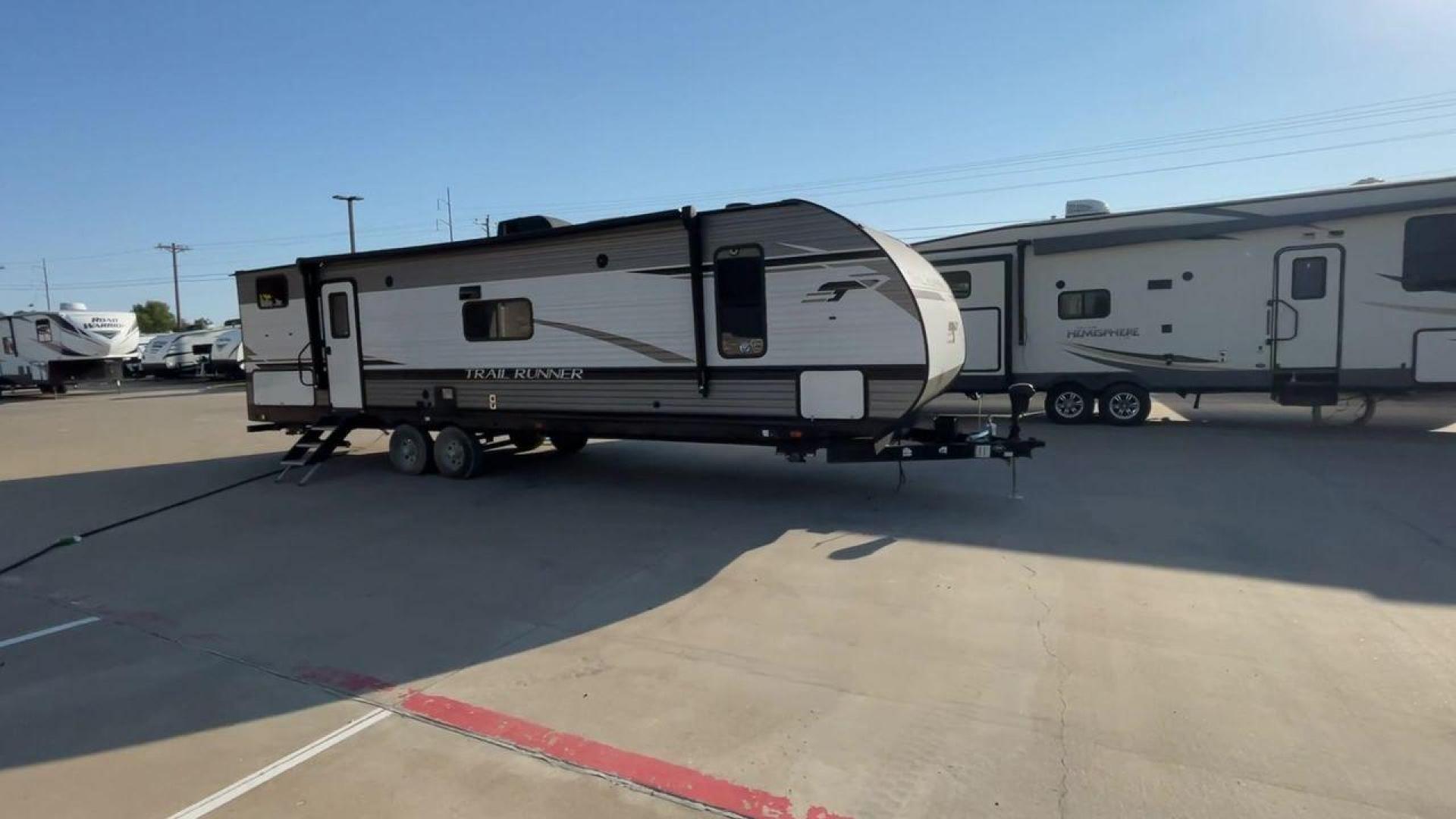 2023 HEARTLAND TRAIL RUNNER 31DB (5SFEB3722PE) , Length: 36.92 ft | Dry Weight: 7,040 lbs | GVWR: 9,642 lbs | Slides: 1 transmission, located at 4319 N Main St, Cleburne, TX, 76033, (817) 678-5133, 32.385960, -97.391212 - The 2023 Heartland Trail Runner 31DB is a versatile and spacious travel trailer designed for families and adventure enthusiasts. This vehicle is the perfect option for families or groups looking to embark on memorable road trips. The travel trailer is a bunkhouse, and features a family-centric layou - Photo#3