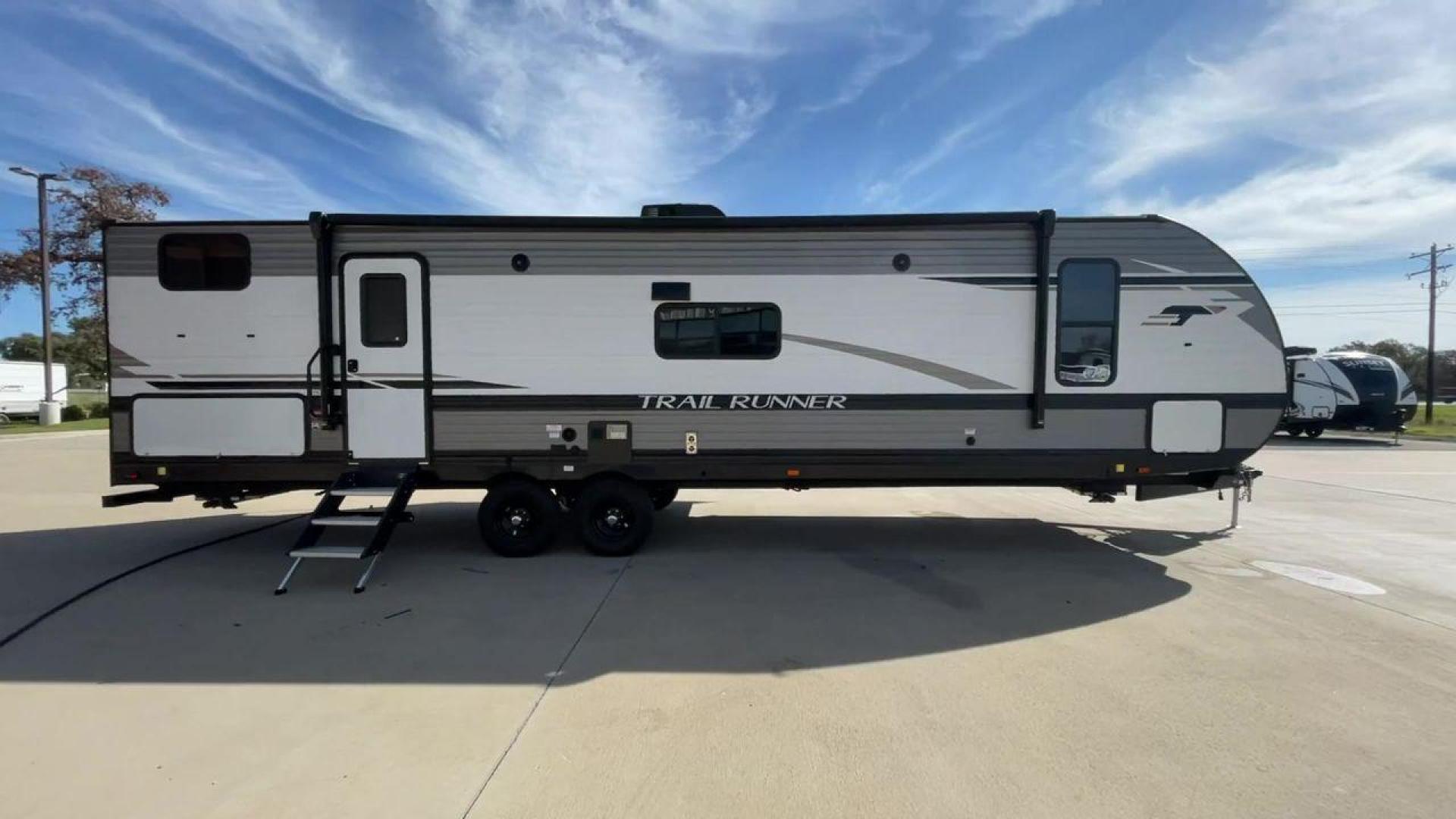 2023 HEARTLAND TRAIL RUNNER 31DB (5SFEB3720PE) , Length: 36.92 ft | Dry Weight: 7,040 lbs | GVWR: 9,642 lbs | Slides: 1 transmission, located at 4319 N Main St, Cleburne, TX, 76033, (817) 678-5133, 32.385960, -97.391212 - Are you looking for the perfect travel trailer to embark on your next adventure? Look no further than this stunning 2023 Heartland Trail Runner 31DB, available for sale at RV Depot in Cleburne, TX. With its exceptional features and unbeatable price of $37,995, this travel trailer is the epitome of l - Photo#2