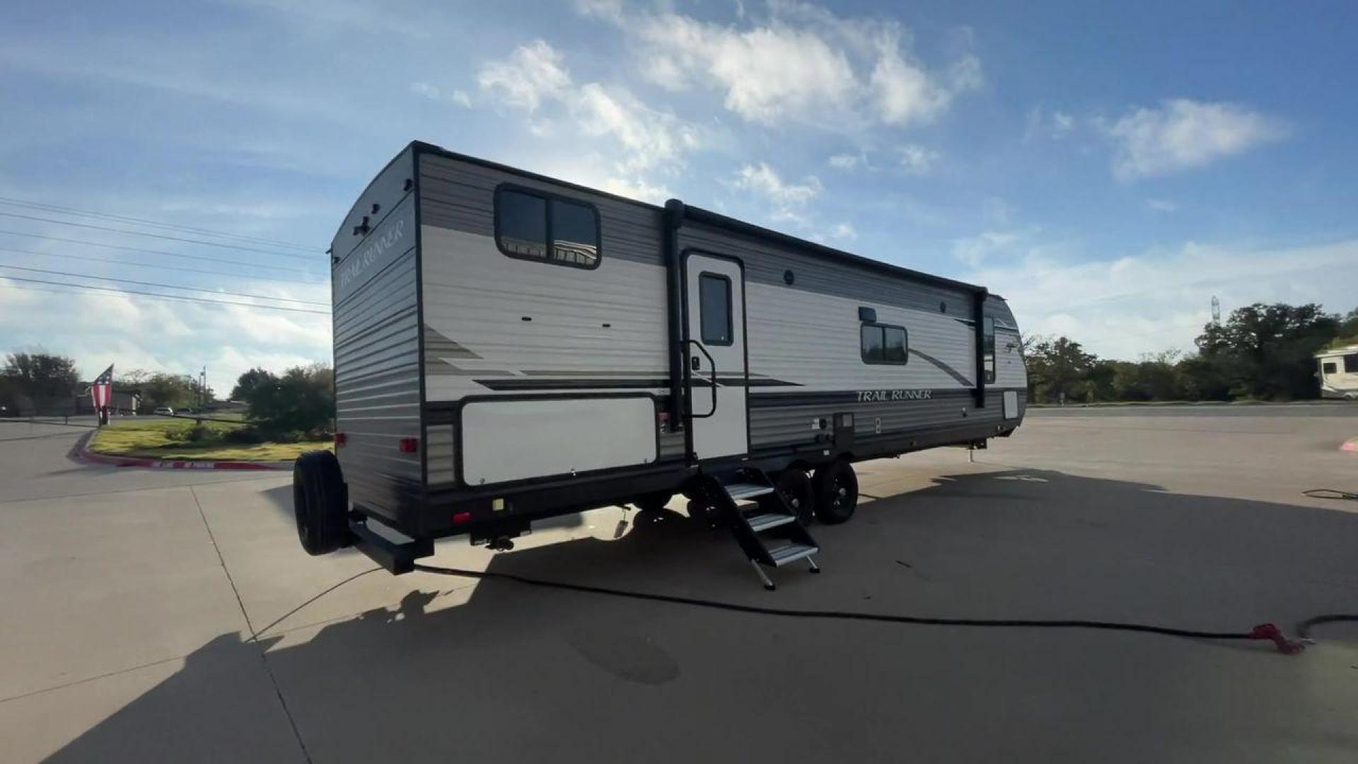 2023 HEARTLAND TRAIL RUNNER 31DB (5SFEB3726PE) , Length: 36.92 ft | Dry Weight: 7,040 lbs | GVWR: 9,642 lbs | Slides: 1 transmission, located at 4319 N Main St, Cleburne, TX, 76033, (817) 678-5133, 32.385960, -97.391212 - The 2023 Heartland Trail Runner 31DB is a versatile and spacious travel trailer designed for families and adventure enthusiasts. This vehicle is the perfect option for families or groups looking to embark on memorable road trips. The travel trailer is a bunkhouse, and features a family-centric layou - Photo#1