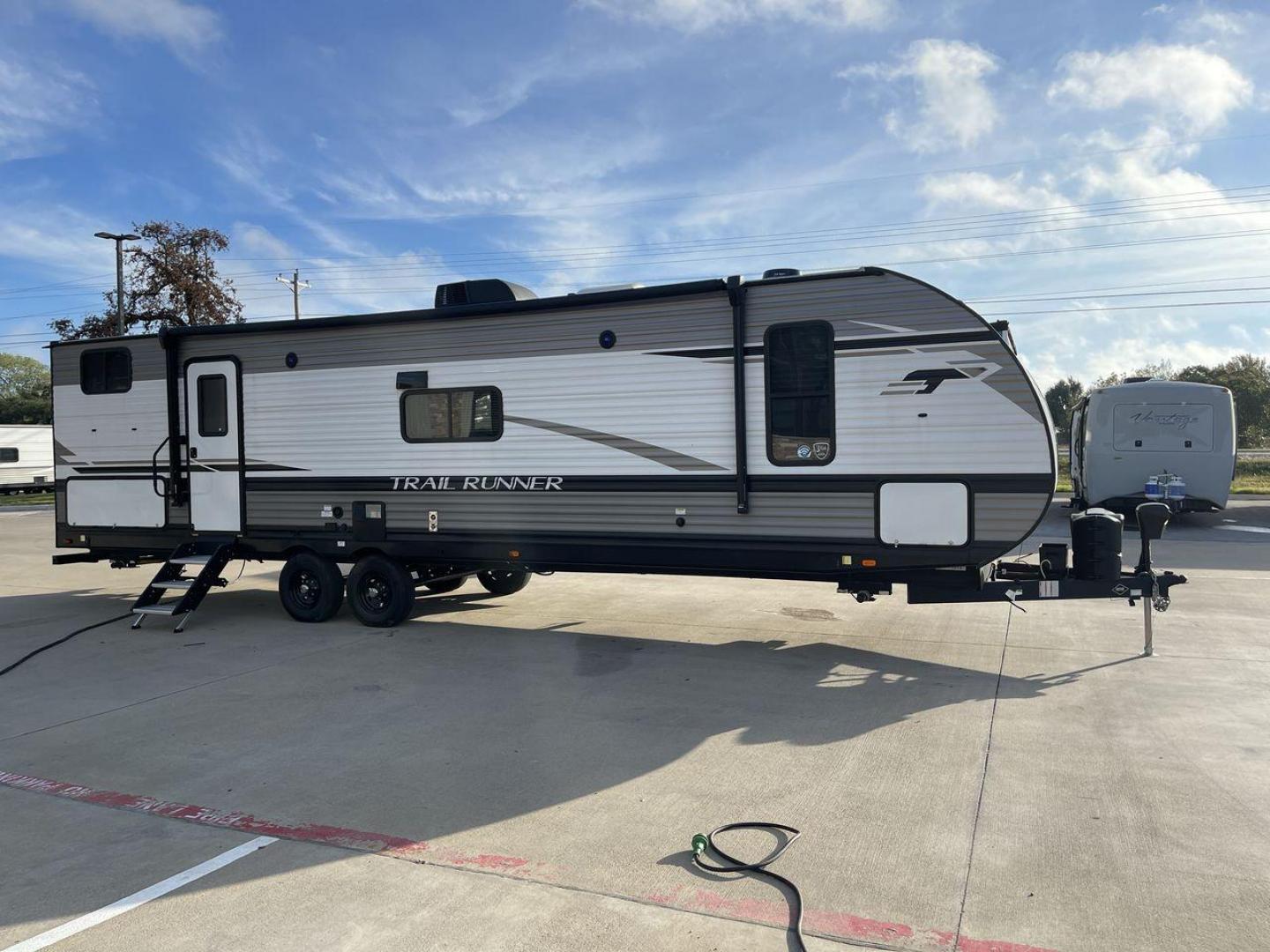 2023 HEARTLAND TRAIL RUNNER 31DB (5SFEB3726PE) , Length: 36.92 ft | Dry Weight: 7,040 lbs | GVWR: 9,642 lbs | Slides: 1 transmission, located at 4319 N Main St, Cleburne, TX, 76033, (817) 678-5133, 32.385960, -97.391212 - The 2023 Heartland Trail Runner 31DB is a versatile and spacious travel trailer designed for families and adventure enthusiasts. This vehicle is the perfect option for families or groups looking to embark on memorable road trips. The travel trailer is a bunkhouse, and features a family-centric layou - Photo#24