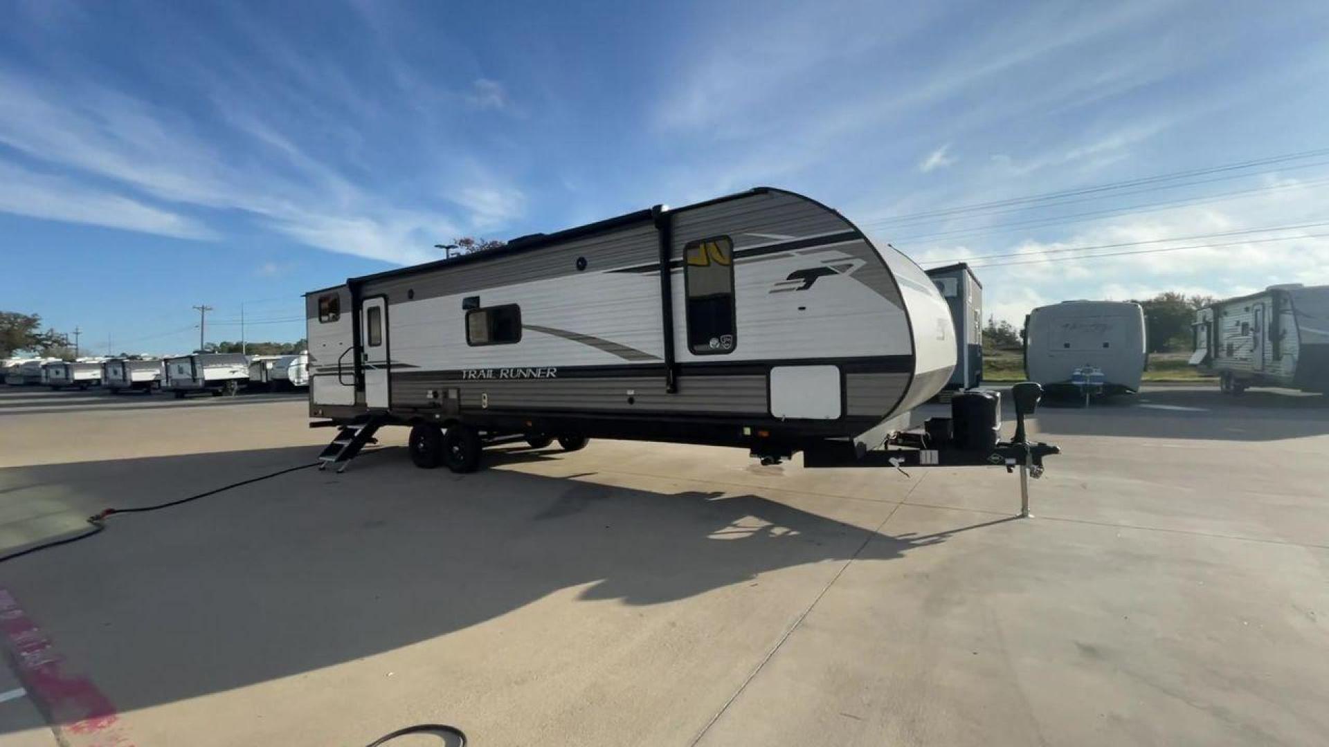 2023 HEARTLAND TRAIL RUNNER 31DB (5SFEB3726PE) , Length: 36.92 ft | Dry Weight: 7,040 lbs | GVWR: 9,642 lbs | Slides: 1 transmission, located at 4319 N Main St, Cleburne, TX, 76033, (817) 678-5133, 32.385960, -97.391212 - The 2023 Heartland Trail Runner 31DB is a versatile and spacious travel trailer designed for families and adventure enthusiasts. This vehicle is the perfect option for families or groups looking to embark on memorable road trips. The travel trailer is a bunkhouse, and features a family-centric layou - Photo#3