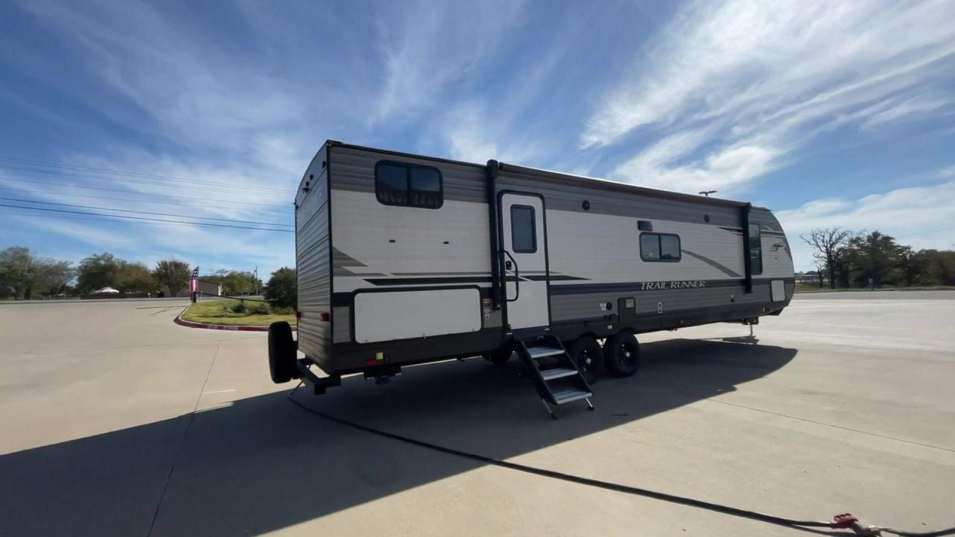 2023 HEARTLAND TRAIL RUNNER 31DB (5SFEB3729PE) , Length: 36.92 ft | Dry Weight: 7,040 lbs | GVWR: 9,642 lbs | Slides: 1 transmission, located at 4319 N Main St, Cleburne, TX, 76033, (817) 678-5133, 32.385960, -97.391212 - The 2023 Heartland Trail Runner 31DB is a versatile and spacious travel trailer designed for families and adventure enthusiasts. This vehicle is the perfect option for families or groups looking to embark on memorable road trips. The travel trailer is a bunkhouse, and features a family-centric layou - Photo#1