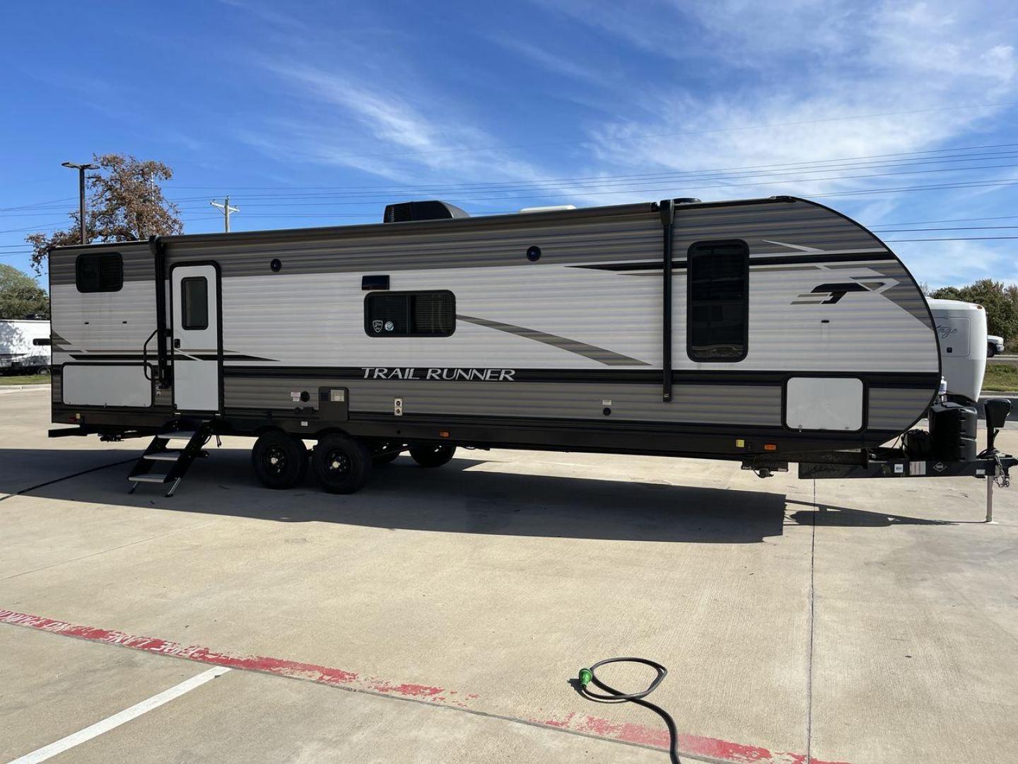 2023 HEARTLAND TRAIL RUNNER 31DB (5SFEB3729PE) , Length: 36.92 ft | Dry Weight: 7,040 lbs | GVWR: 9,642 lbs | Slides: 1 transmission, located at 4319 N Main St, Cleburne, TX, 76033, (817) 678-5133, 32.385960, -97.391212 - The 2023 Heartland Trail Runner 31DB is a versatile and spacious travel trailer designed for families and adventure enthusiasts. This vehicle is the perfect option for families or groups looking to embark on memorable road trips. The travel trailer is a bunkhouse, and features a family-centric layou - Photo#25