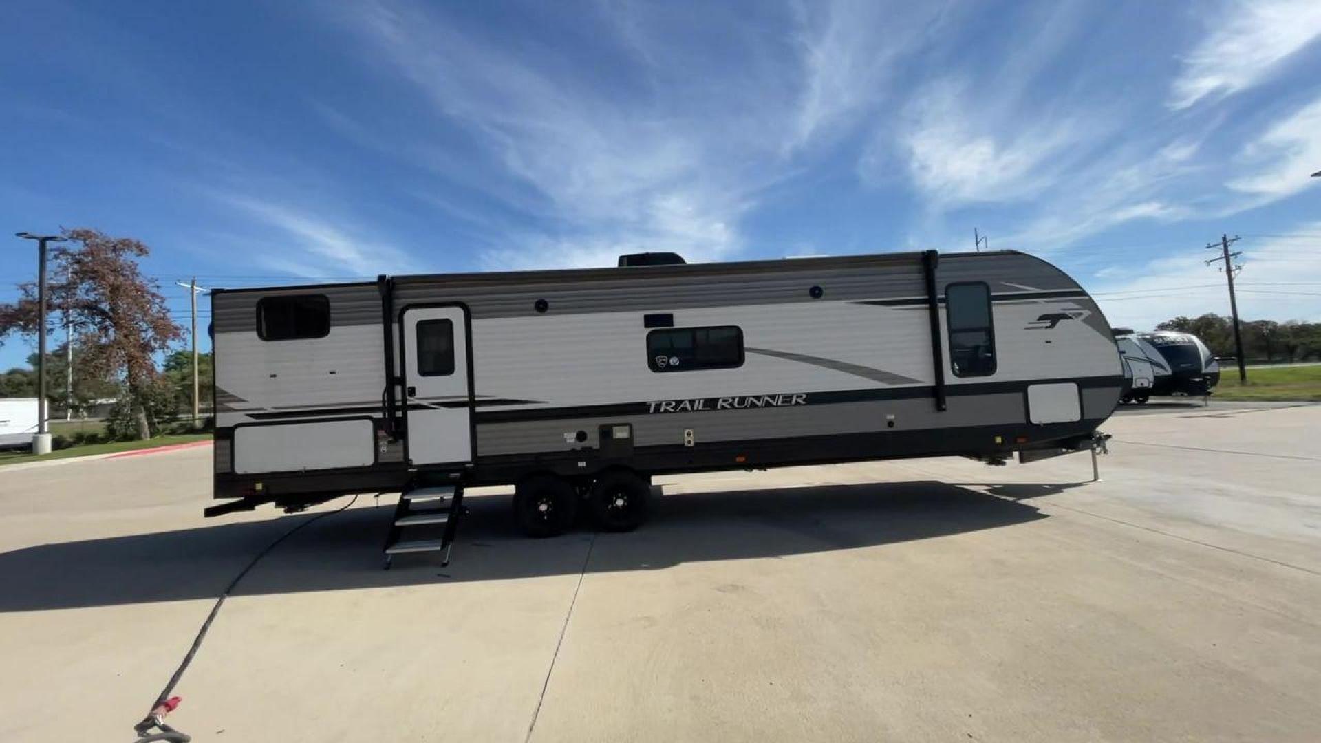 2023 HEARTLAND TRAIL RUNNER 31DB (5SFEB3729PE) , Length: 36.92 ft | Dry Weight: 7,040 lbs | GVWR: 9,642 lbs | Slides: 1 transmission, located at 4319 N Main St, Cleburne, TX, 76033, (817) 678-5133, 32.385960, -97.391212 - The 2023 Heartland Trail Runner 31DB is a versatile and spacious travel trailer designed for families and adventure enthusiasts. This vehicle is the perfect option for families or groups looking to embark on memorable road trips. The travel trailer is a bunkhouse, and features a family-centric layou - Photo#2