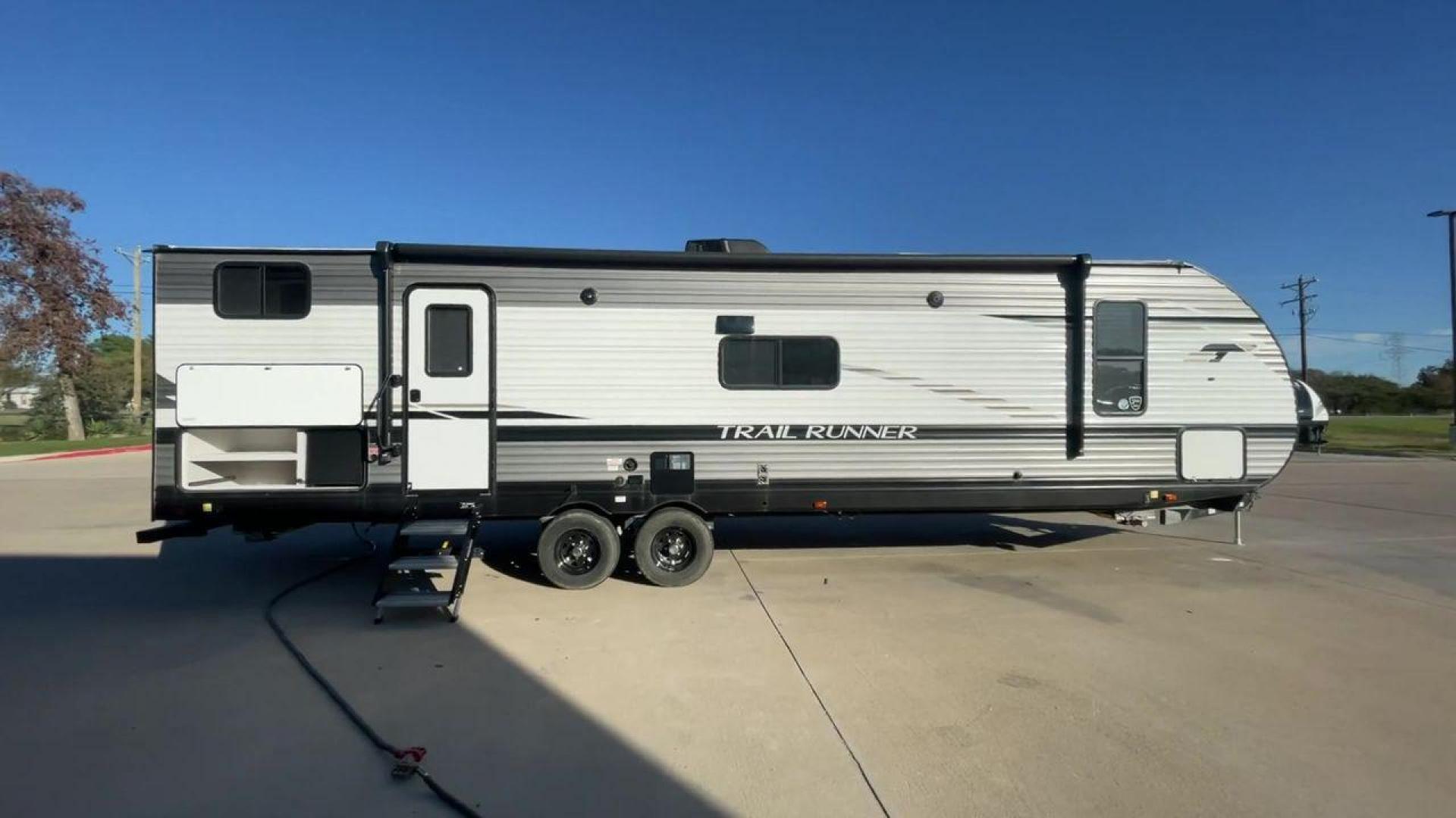 2023 HEARTLAND TRAIL RUNNER 31DB (5SFEB3723PE) , Length: 36.92 ft | Dry Weight: 7,040 lbs | GVWR: 9,642 lbs | Slides: 1 transmission, located at 4319 N Main St, Cleburne, TX, 76033, (817) 678-5133, 32.385960, -97.391212 - The 2023 Heartland Trail Runner 31DB is a versatile and spacious travel trailer designed for families and adventure enthusiasts. This vehicle is the perfect option for families or groups looking to embark on memorable road trips. The travel trailer is a bunkhouse, and features a family-centric layou - Photo#2