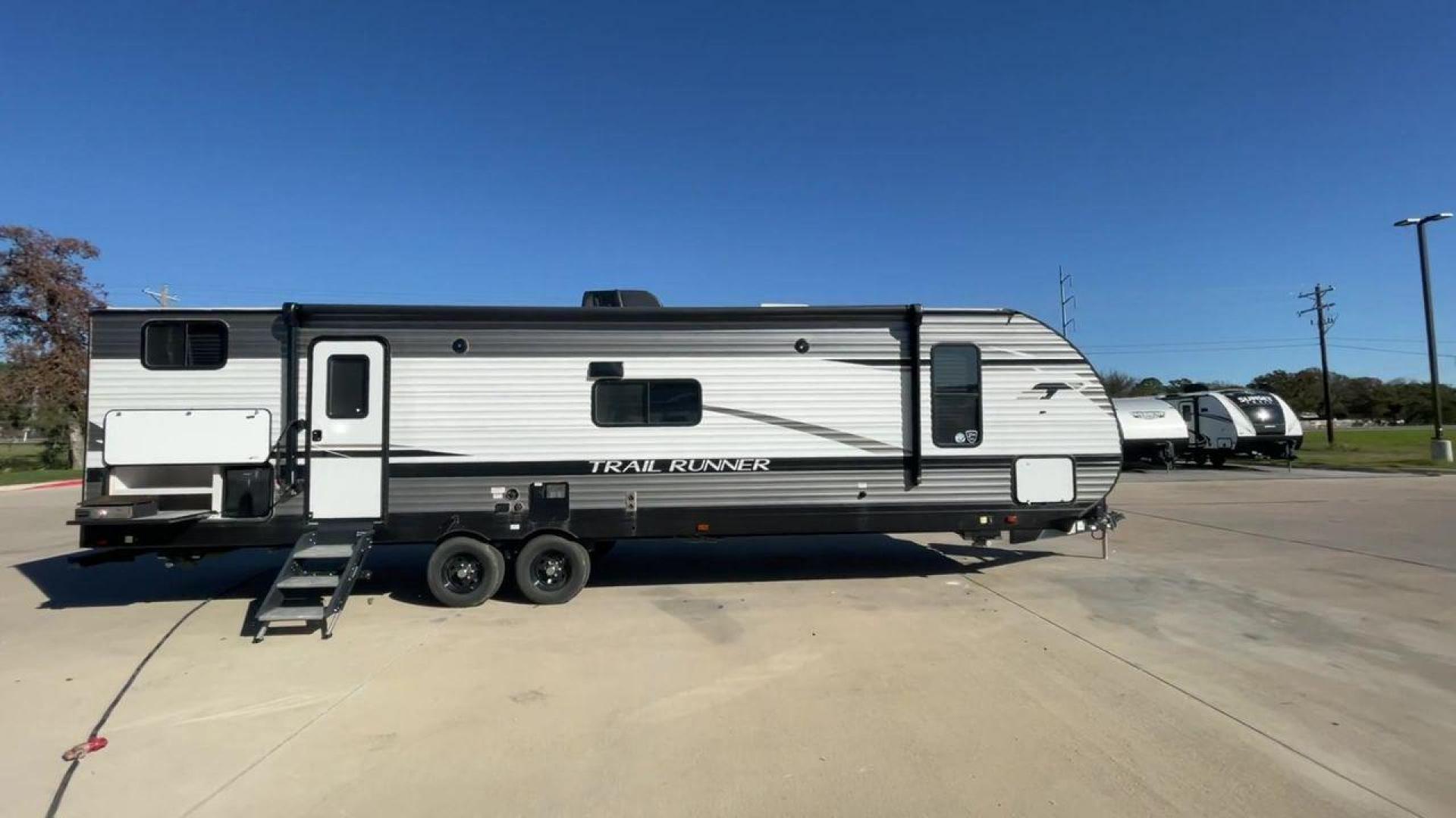 2023 HEARTLAND TRAIL RUNNER 31DB (5SFEB3720PE) , Length: 36.92 ft. | Dry Weight: 7,040 lbs. | Gross Weight: 9,642 lbs. | Slides: 1 transmission, located at 4319 N Main St, Cleburne, TX, 76033, (817) 678-5133, 32.385960, -97.391212 - The 2023 Heartland Trail Runner 31DB is a versatile and spacious travel trailer designed for families and adventure enthusiasts. This vehicle is the perfect option for families or groups looking to embark on memorable road trips. The travel trailer is a bunkhouse, and features a family-centric layou - Photo#2