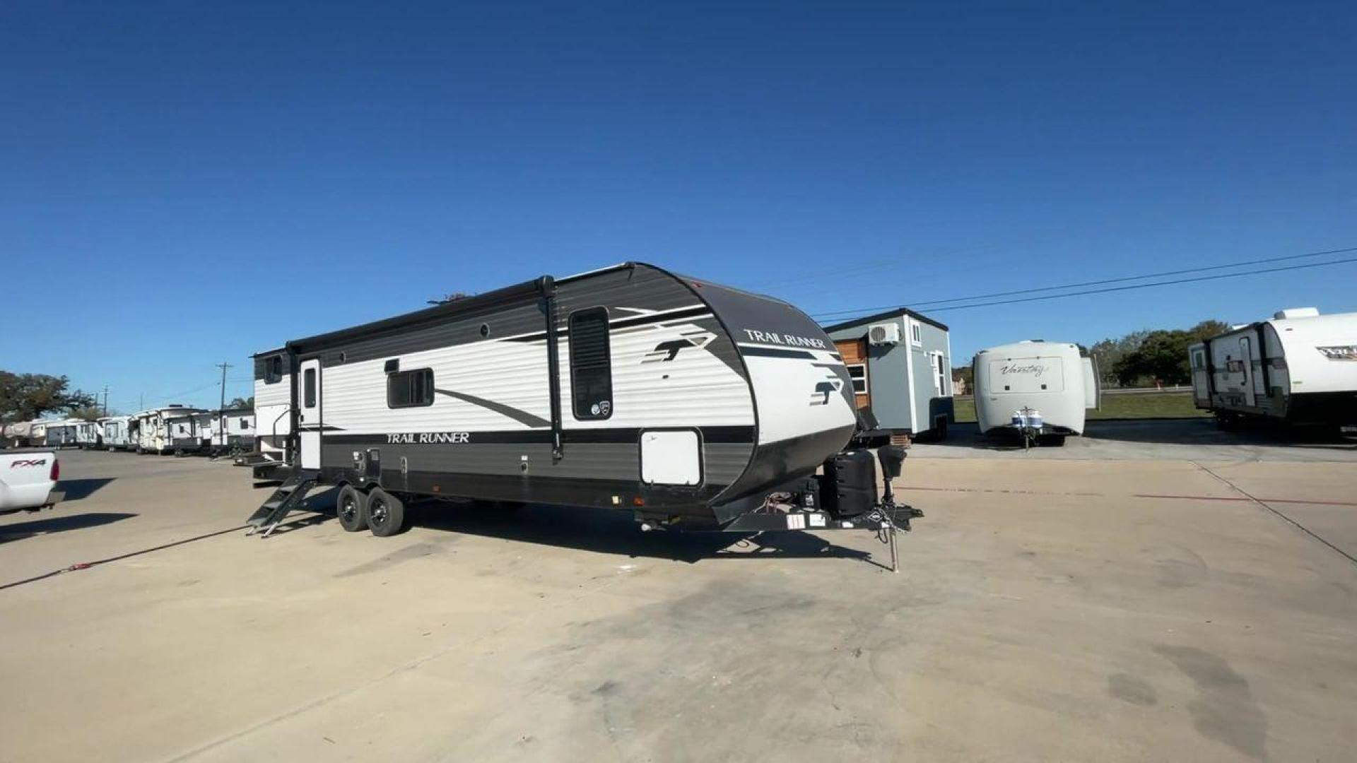 2023 HEARTLAND TRAIL RUNNER 31DB (5SFEB3720PE) , Length: 36.92 ft. | Dry Weight: 7,040 lbs. | Gross Weight: 9,642 lbs. | Slides: 1 transmission, located at 4319 N Main St, Cleburne, TX, 76033, (817) 678-5133, 32.385960, -97.391212 - The 2023 Heartland Trail Runner 31DB is a versatile and spacious travel trailer designed for families and adventure enthusiasts. This vehicle is the perfect option for families or groups looking to embark on memorable road trips. The travel trailer is a bunkhouse, and features a family-centric layou - Photo#3