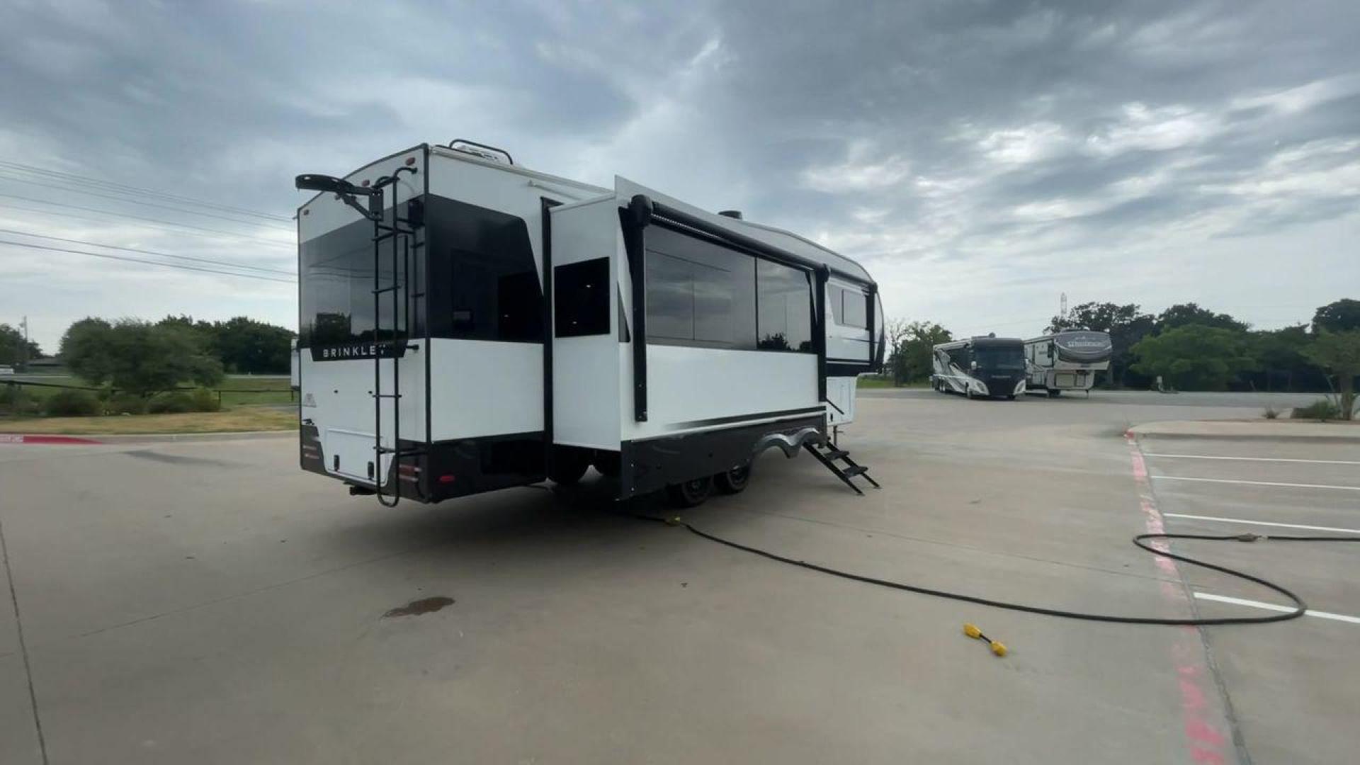 2024 BRINKLEY MODEL Z 2900 (7T0FZ3426RA) , Length: 32.92 ft. | Gross Weight: 14,495 lbs. | Slides: 3 transmission, located at 4319 N Main St, Cleburne, TX, 76033, (817) 678-5133, 32.385960, -97.391212 - The 2024 Brinkley Model Z 2900 RV showcases a modern, streamlined interior design emphasizing functionality and luxury. Upon entering, you’re greeted by a sleek kitchen featuring a huge center island with a built-in stainless steel sink and modern fixtures. The island provides ample counter space - Photo#1