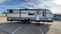 2024 KEYSTONE ASPEN TRAIL 29BH (4YDTATN23R8) , Length: 33.25 ft | Dry Weight: 6,484 lbs | Slides: 1 transmission, located at 4319 N Main St, Cleburne, TX, 76033, (817) 678-5133, 32.385960, -97.391212 - This used Keystone Aspen Trail 29BH is a well-maintained travel trailer with a modern and stylish exterior. Its silver and dark gray aluminum siding gives it a sleek, clean appearance, with white accents and a well-defined design pattern along the sides. It is equipped with multiple windows, enhanci - Photo#2