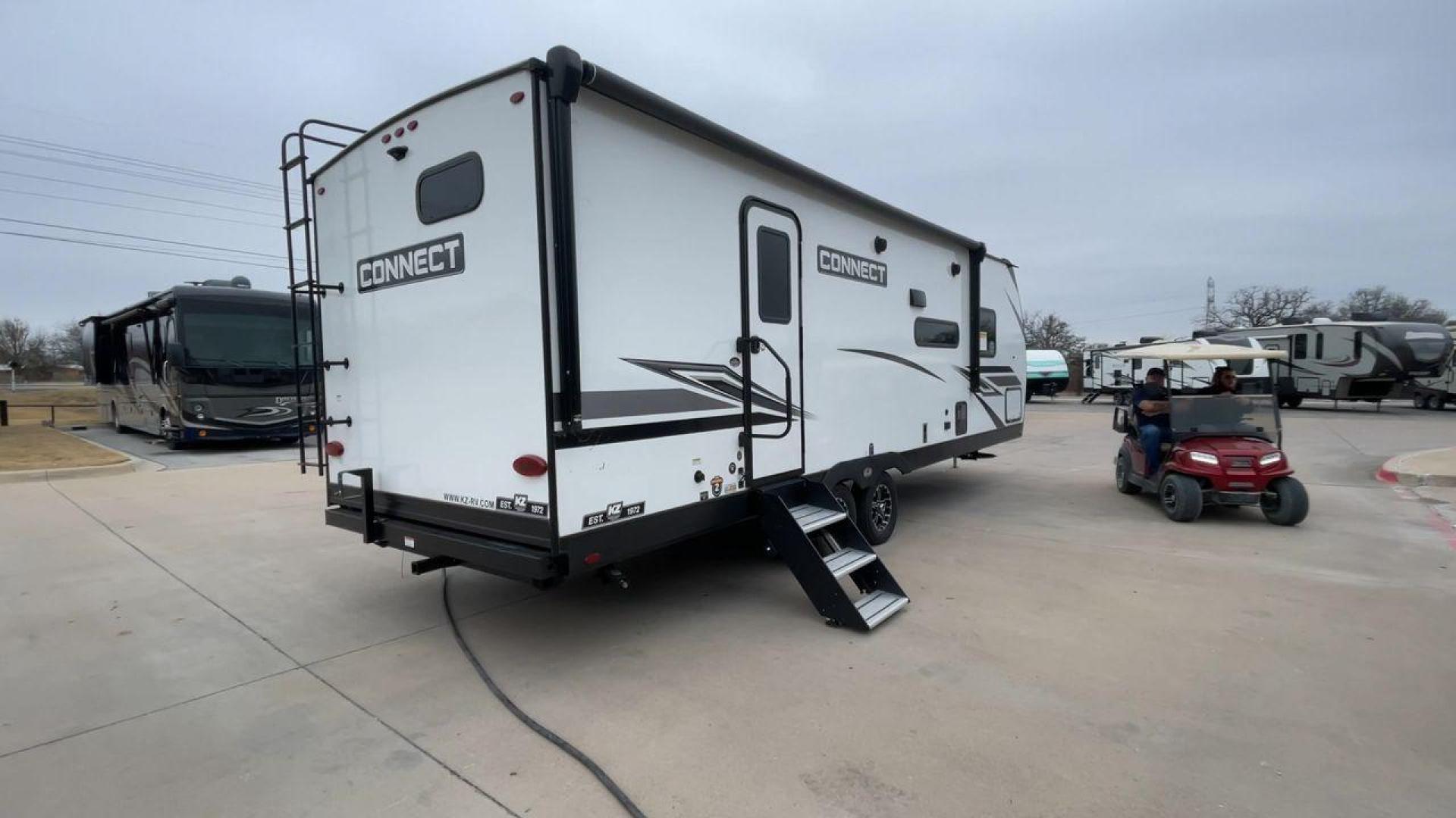 2024 KZ CONNECT 261RB (4EZTL2721R7) , Length: 30.33 ft | Dry Weight: 6,460 lbs | Gross Weight: 7,345 lbs | Slides: 1 transmission, located at 4319 N Main St, Cleburne, TX, 76033, (817) 678-5133, 32.385960, -97.391212 - At 30.33 ft long, the 2024 KZ Connect 261RB is a modern and stylish travel trailer with a sleek and aerodynamic design. Its white fiberglass exterior is accented with black and gray geometric decals, giving it a sharp and contemporary look. The front cap is painted black with the CONNECT branding pr - Photo#1