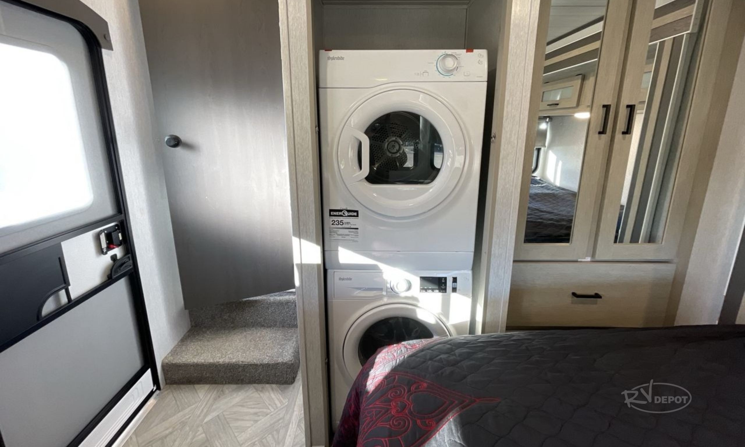 RV Depot - Inside RV Bedroom with a Washer and Dryer scaled Inside RV Bedroom with a Washer and Dryer