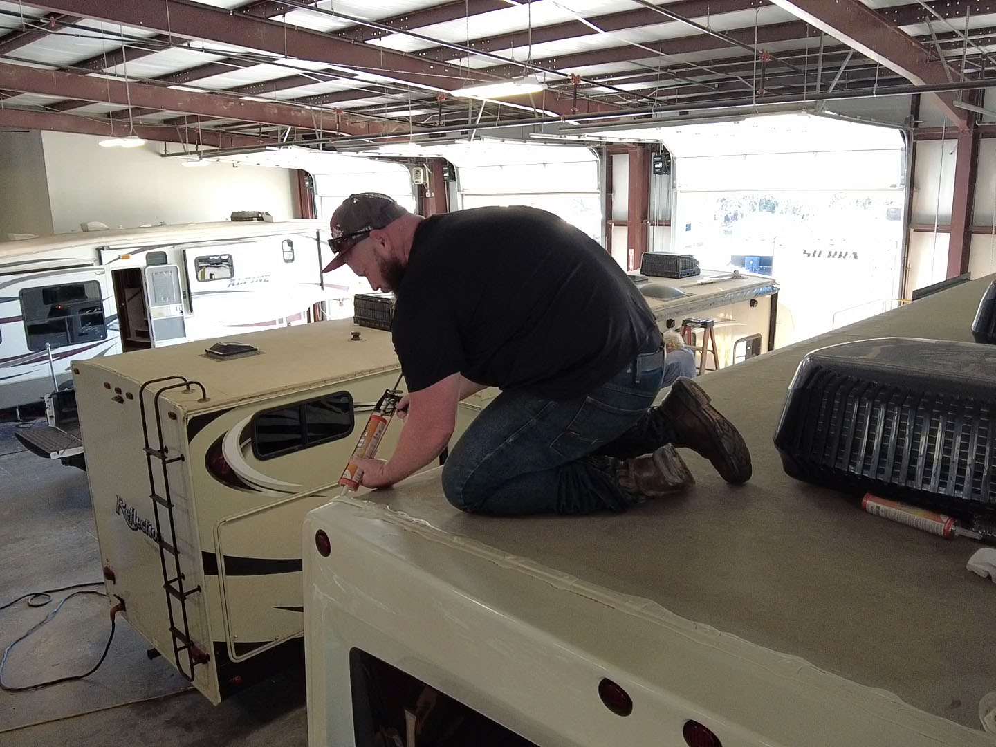 Man Repairing RV Roof
